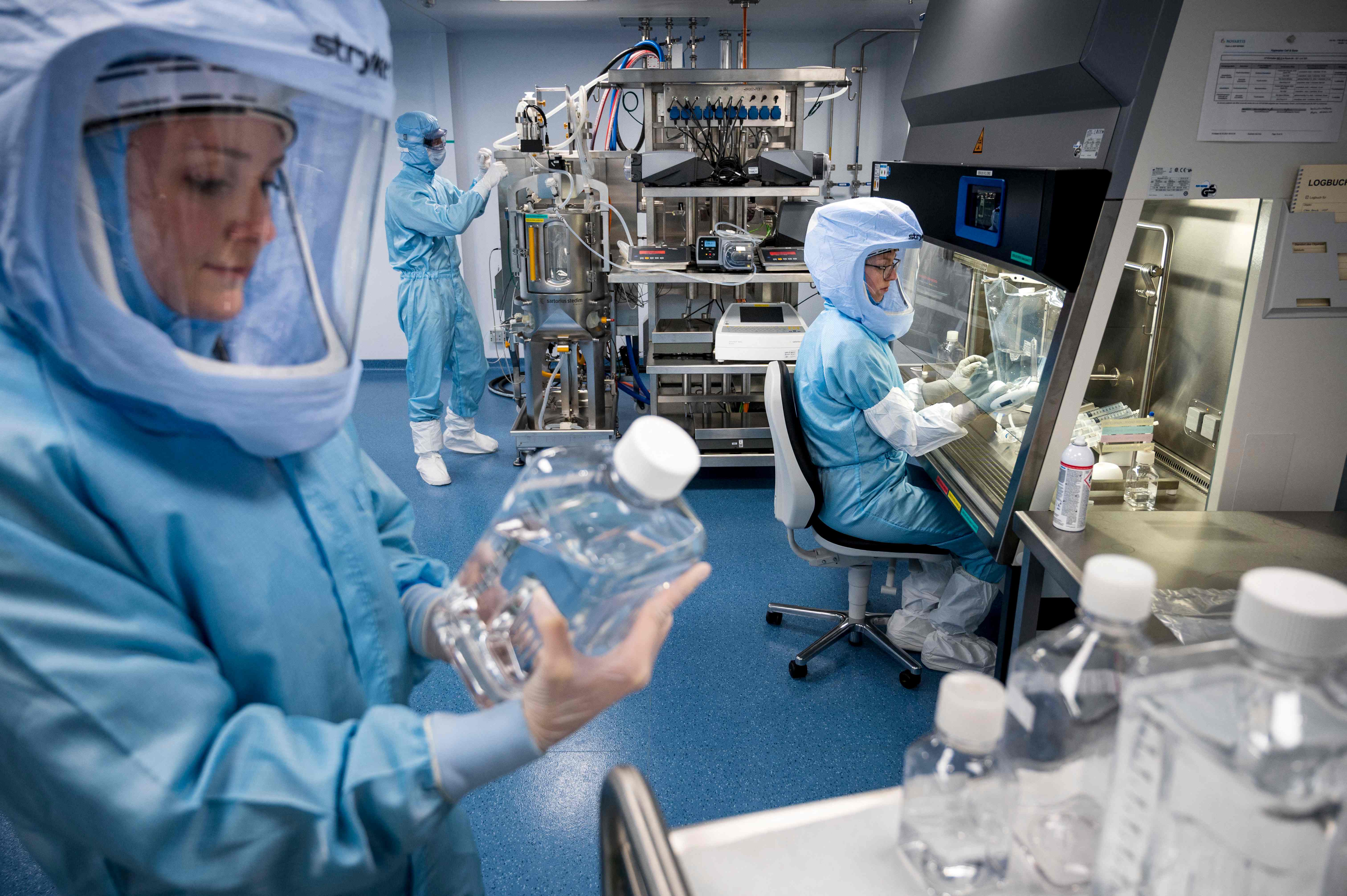 BioNTech employees work at a manufacturing facility in Marburg, Germany, in 2021. The pharmaceutical company partnered with Pfizer to produce coronavirus vaccines. (Thomas Lohnes/AFP/Getty Images)