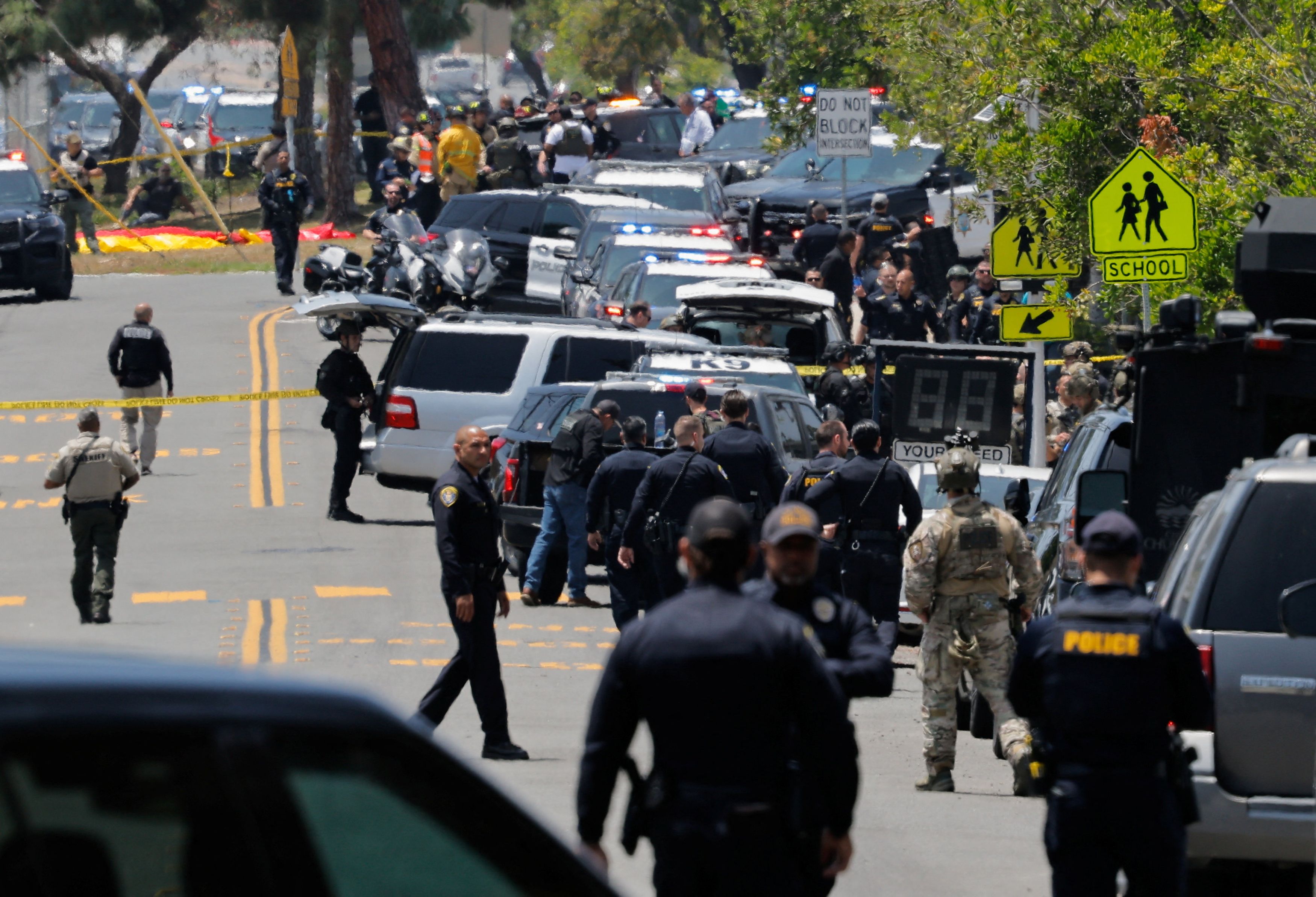 Emergency workers respond at the Islamic Center in San Diego. Scott Wahl, the city's police chief, told reporters that the shooting is being investigated as a hate crime due to its location. (Mike Blake/Reuters)