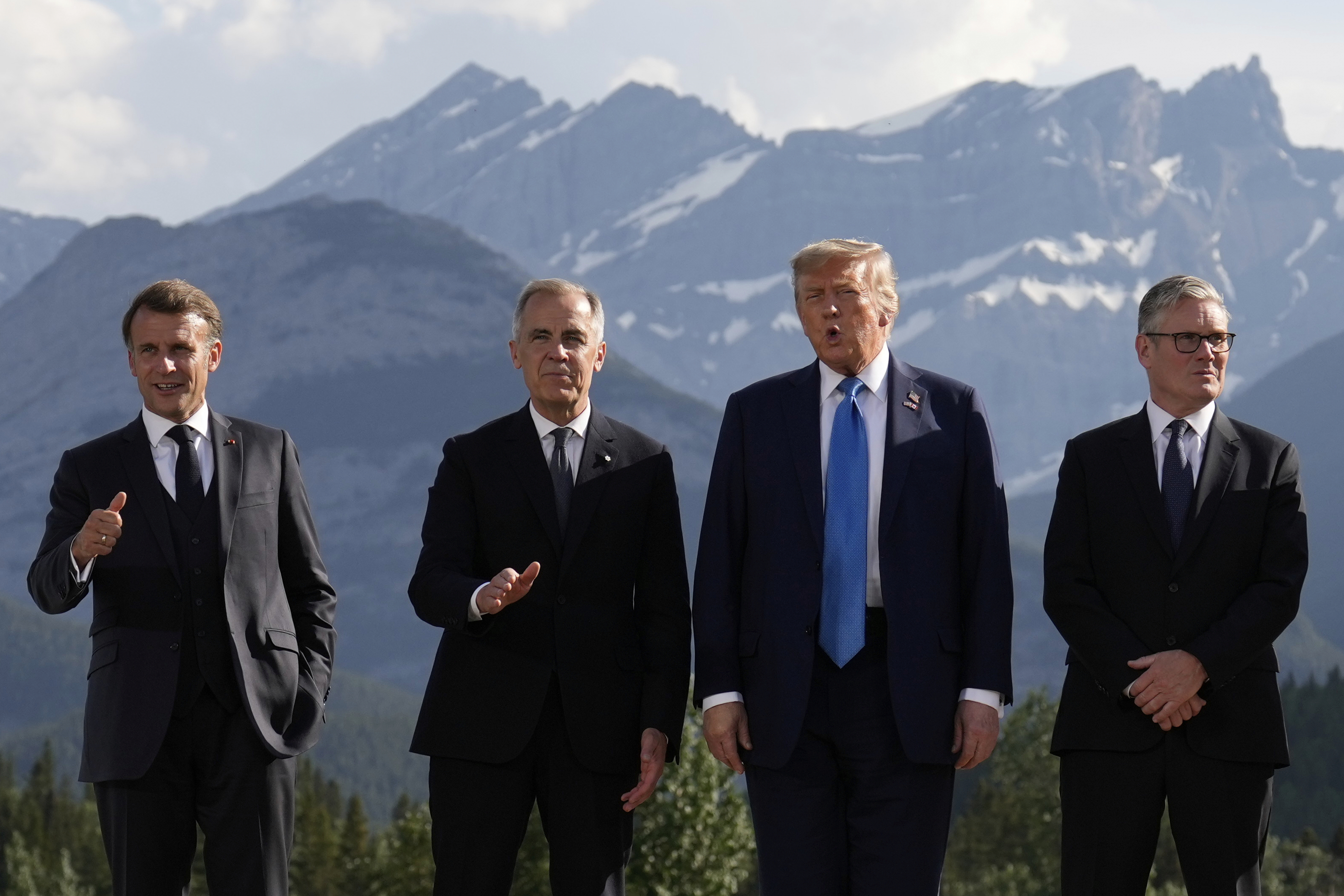 From left, French President Emmanuel Macron, Canadian Prime Minister Mark Carney, President Donald Trump and British Prime Minister Keir Starmer at the Group of Seven summit in 2025. (Mark Schiefelbein/AP)