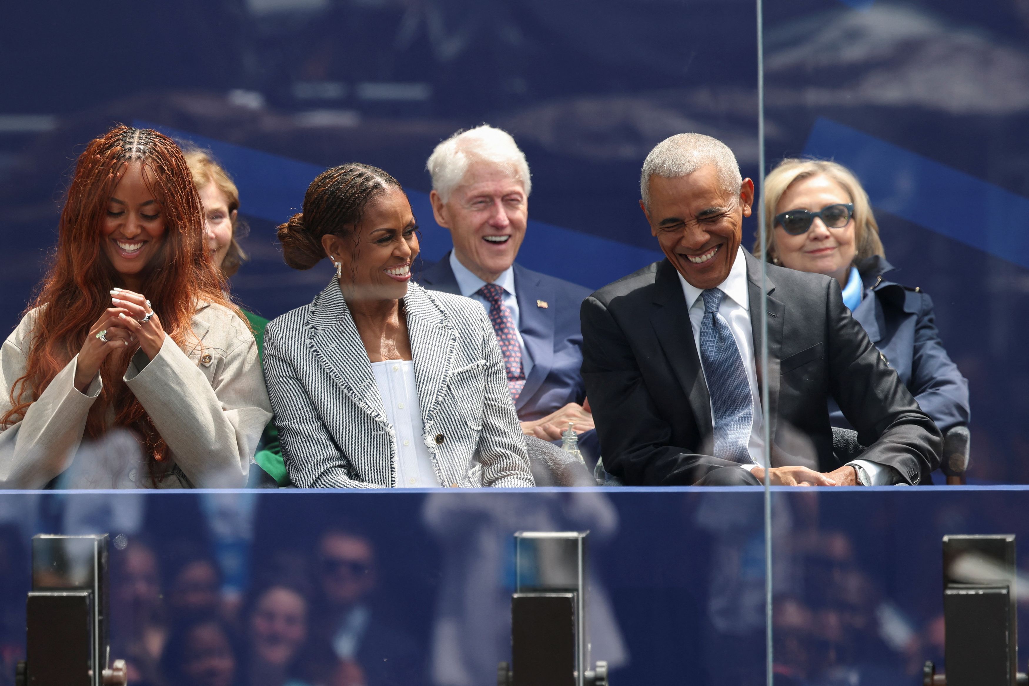 Former president Barack Obama, Michelle Obama, and Malia Obama attend a dedication ceremony for the opening of the Obama Presidential Center. (Brendan McDermid/Reuters)