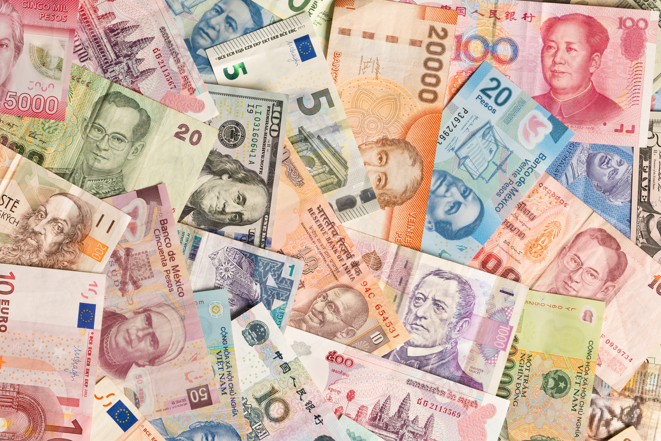 Collection of international currency. (iStock)