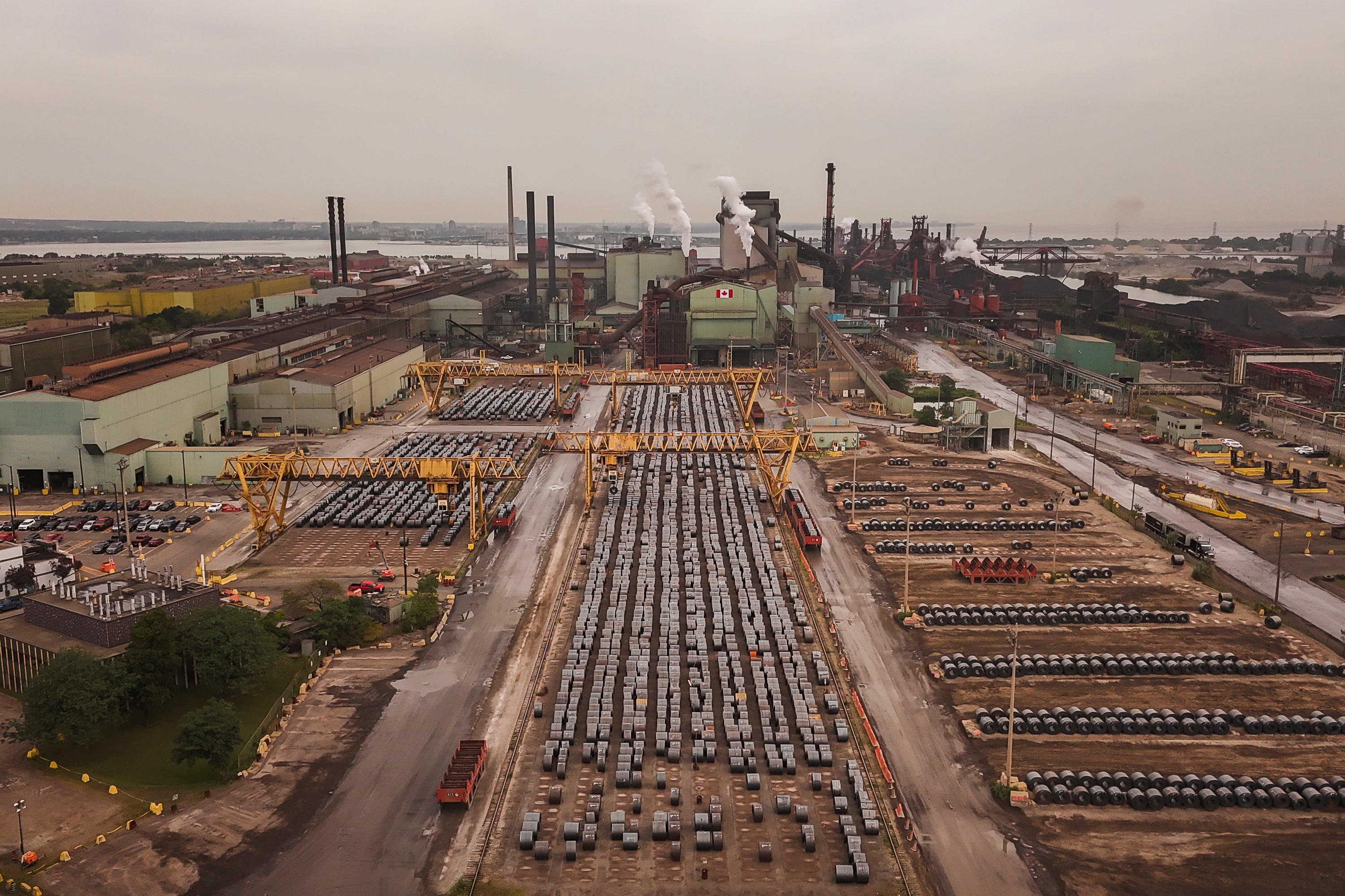 Rolled coils of steel sit in the yard at the ArcelorMittal Dofasco steel plant in Hamilton, Ontario, this month. (Nick Iwanyshyn/Canadian Press/AP)