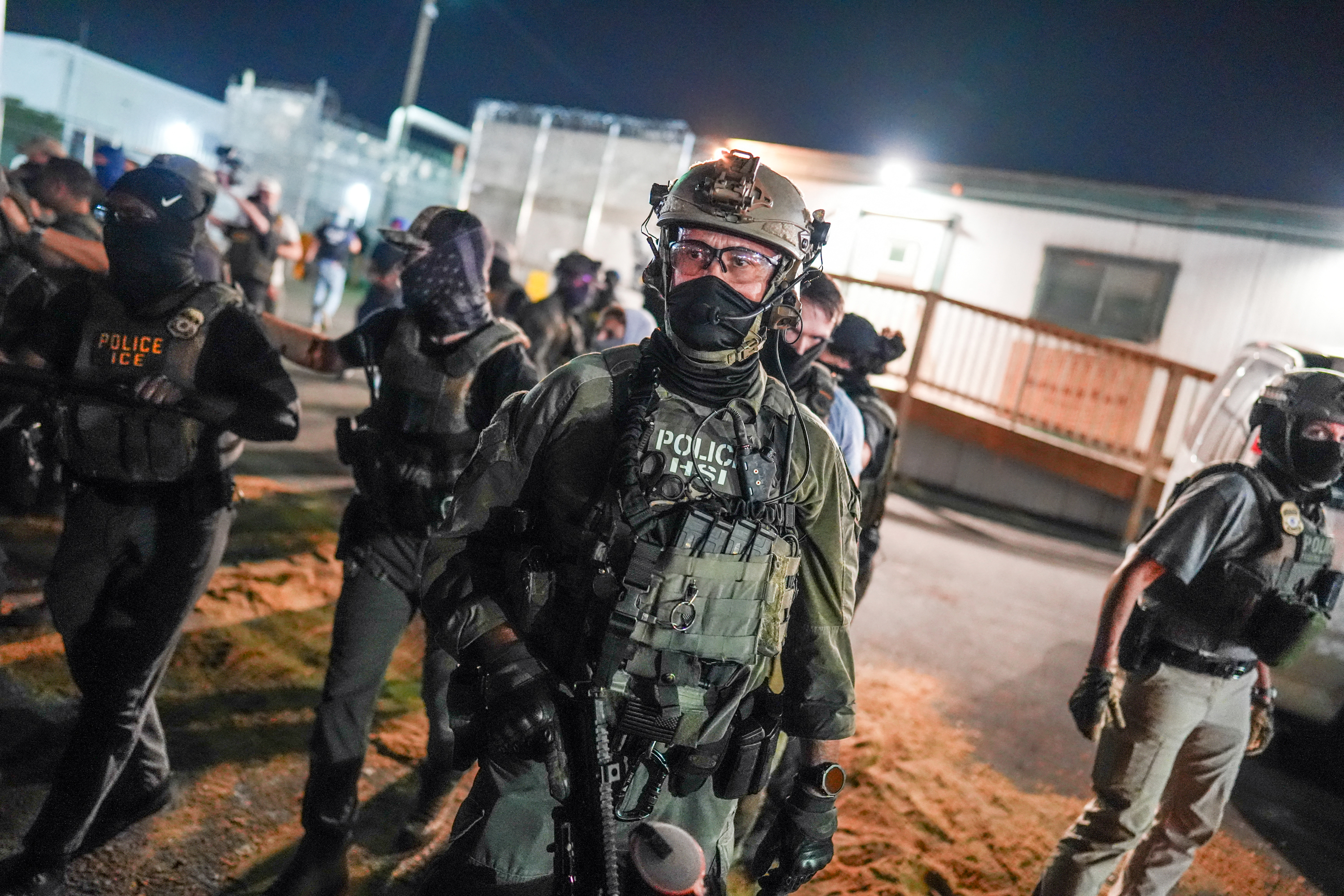 Federal agents in Newark block protesters on June 5 from approaching the entrance of a facility being used as an Immigration and Customs Enforcement detention center. (Ryan Murphy/AFP/Getty Images)