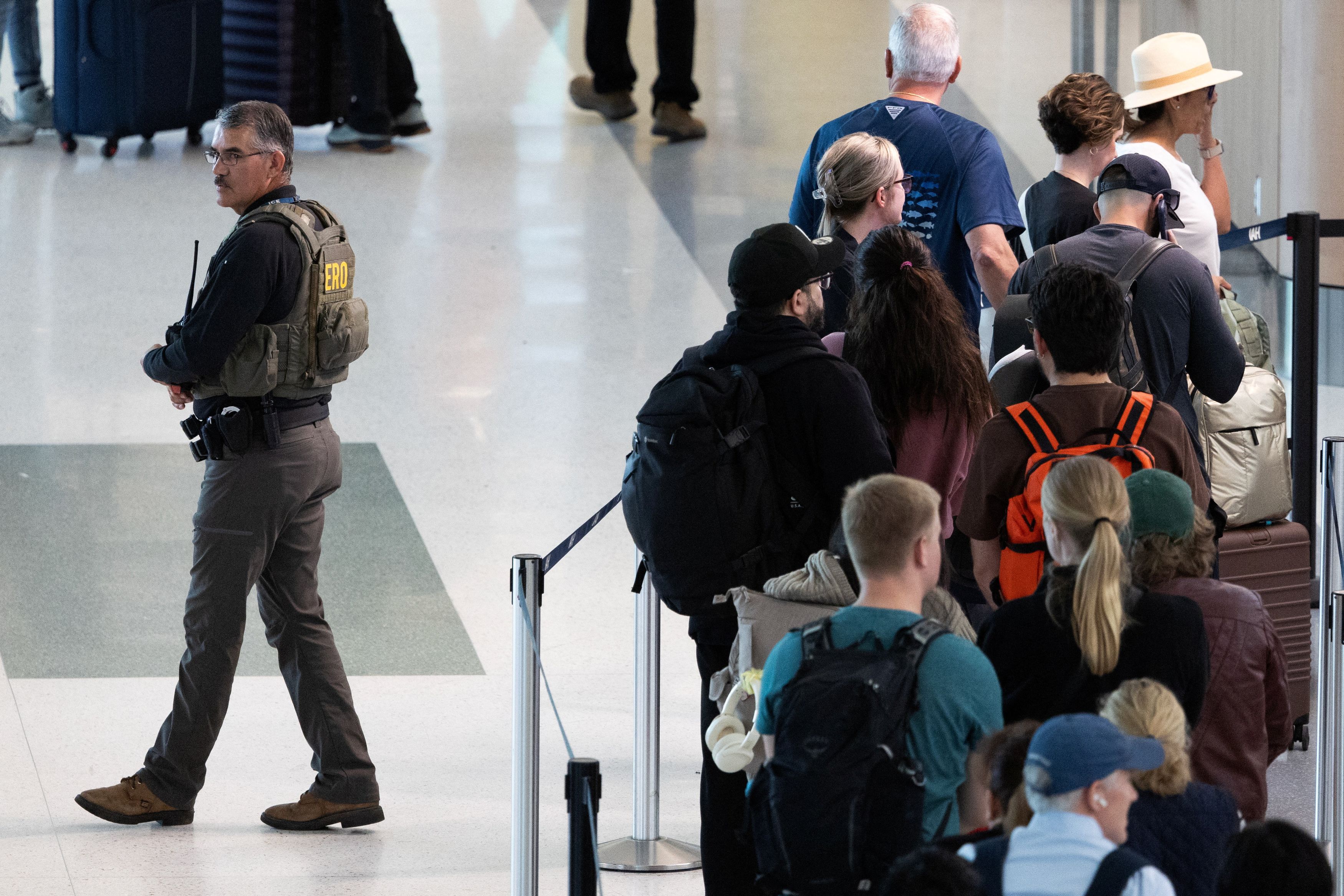 Passengers wait in long TSA lines at George Bush Intercontinental Airport in Houston on Wednesday. (Antranik Tavitian/Reuters)
