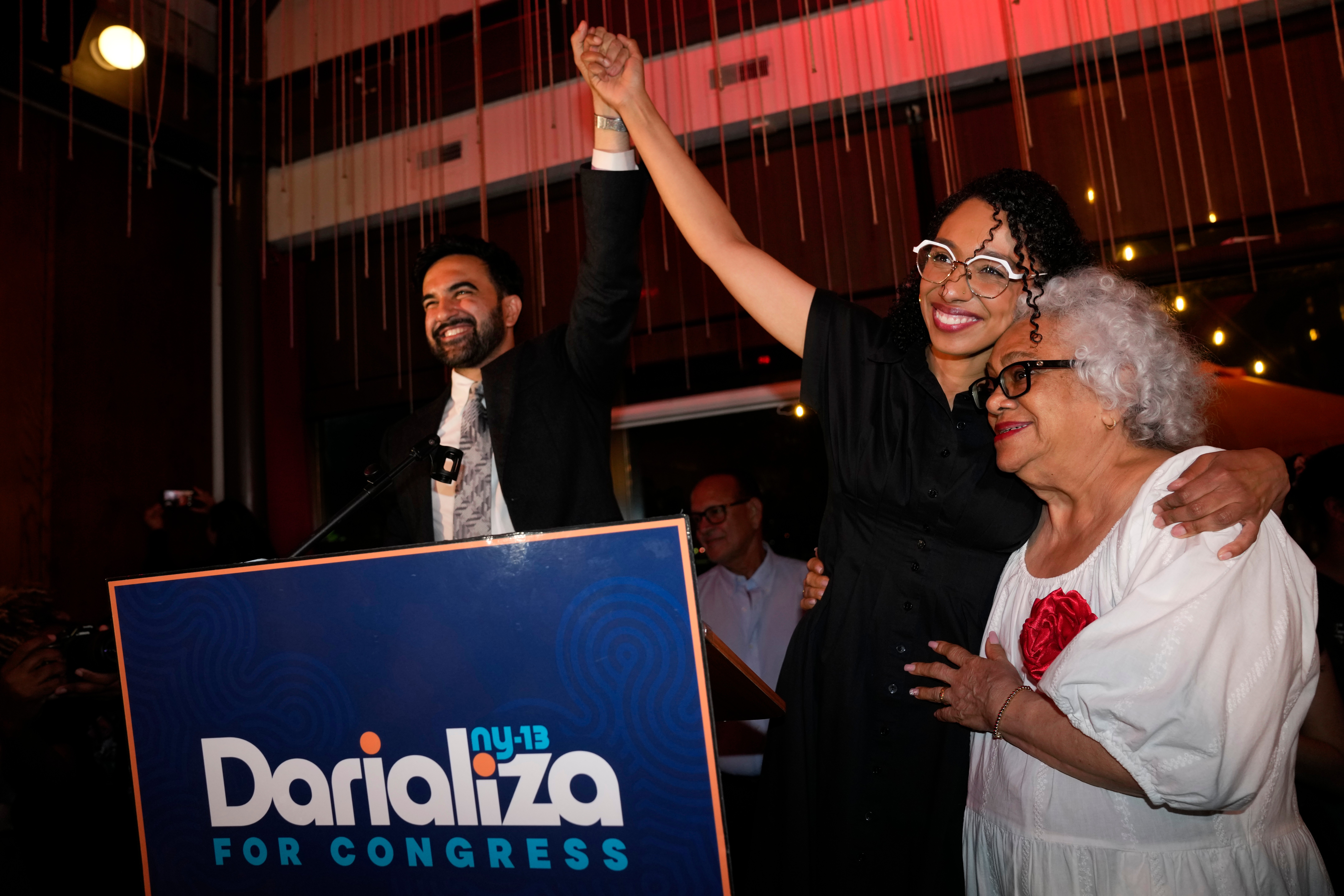 New York City Mayor Zohran Mamdani celebrates with Democratic congressional candidate Darializa Avila Chevalier, middle, and organizer Carmen Rojas during an election night watch party Tuesday in New York. (Seth Wenig/AP)