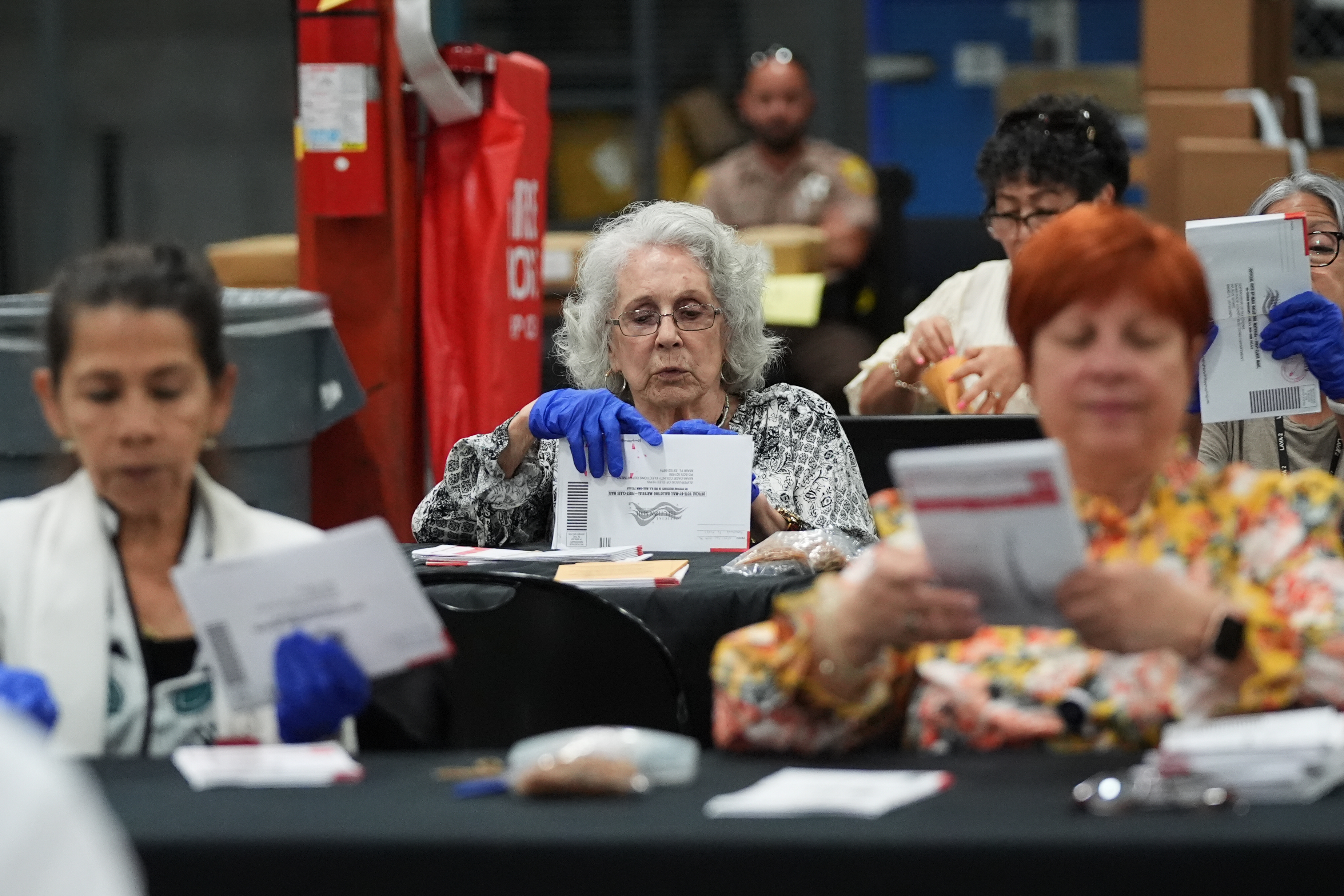 Election workers at the Miami-Dade County Supervisor of Elections Office on Aug. 18 during Florida’s primaries. (Lynne Sladky/AP)