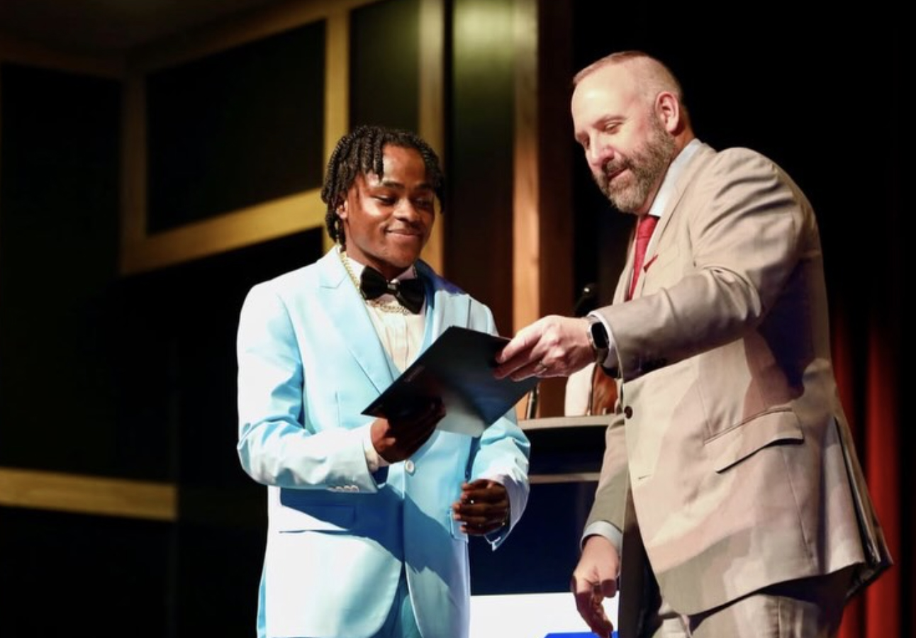 Pierre Damas Bel receives his high school diploma. (Family Photo/Instagram)