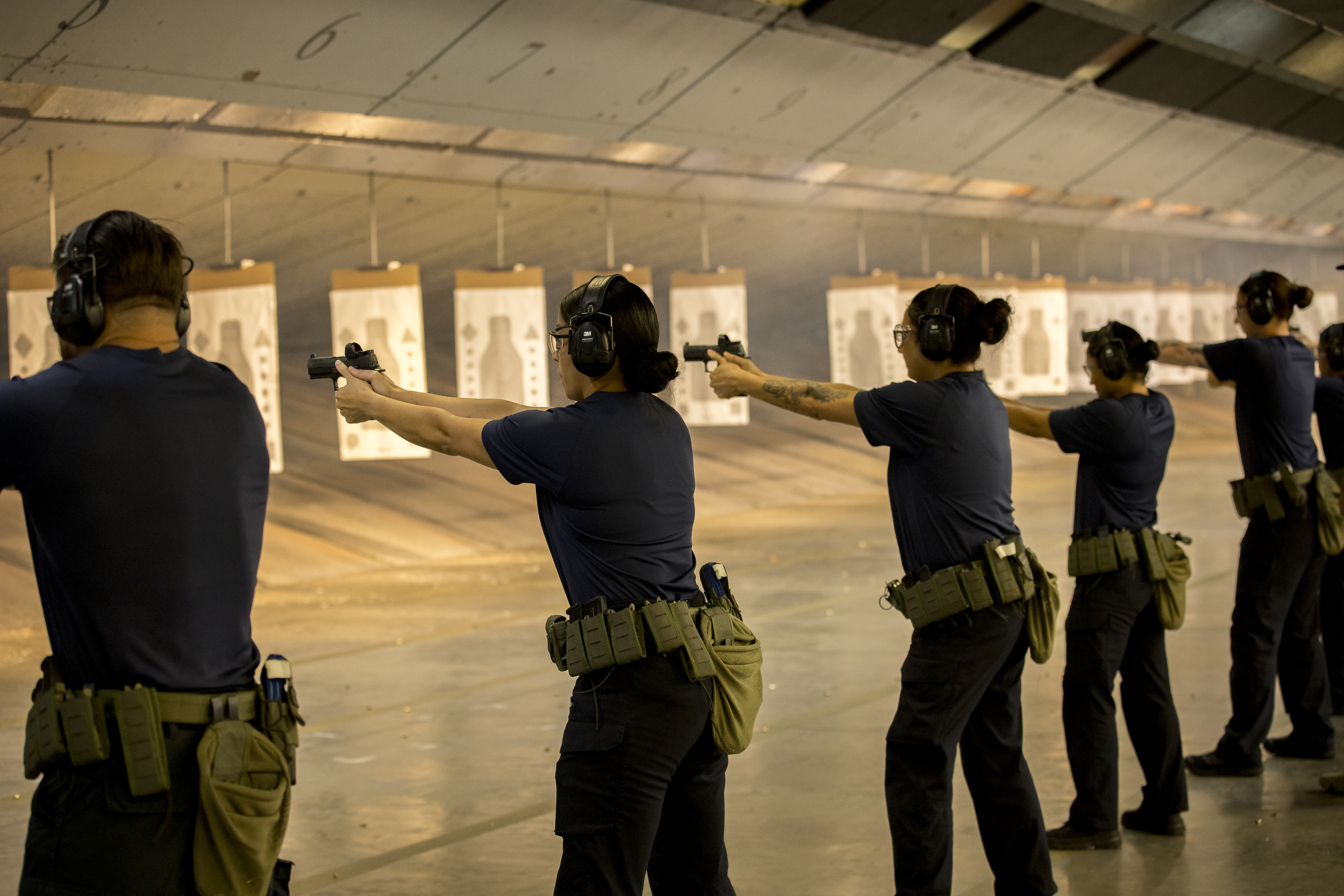 ICE recruits train at the indoor gun range at the Federal Law Enforcement Training Centers in Glynco, Georgia, on Aug. 21. (Stephen B. Morton)