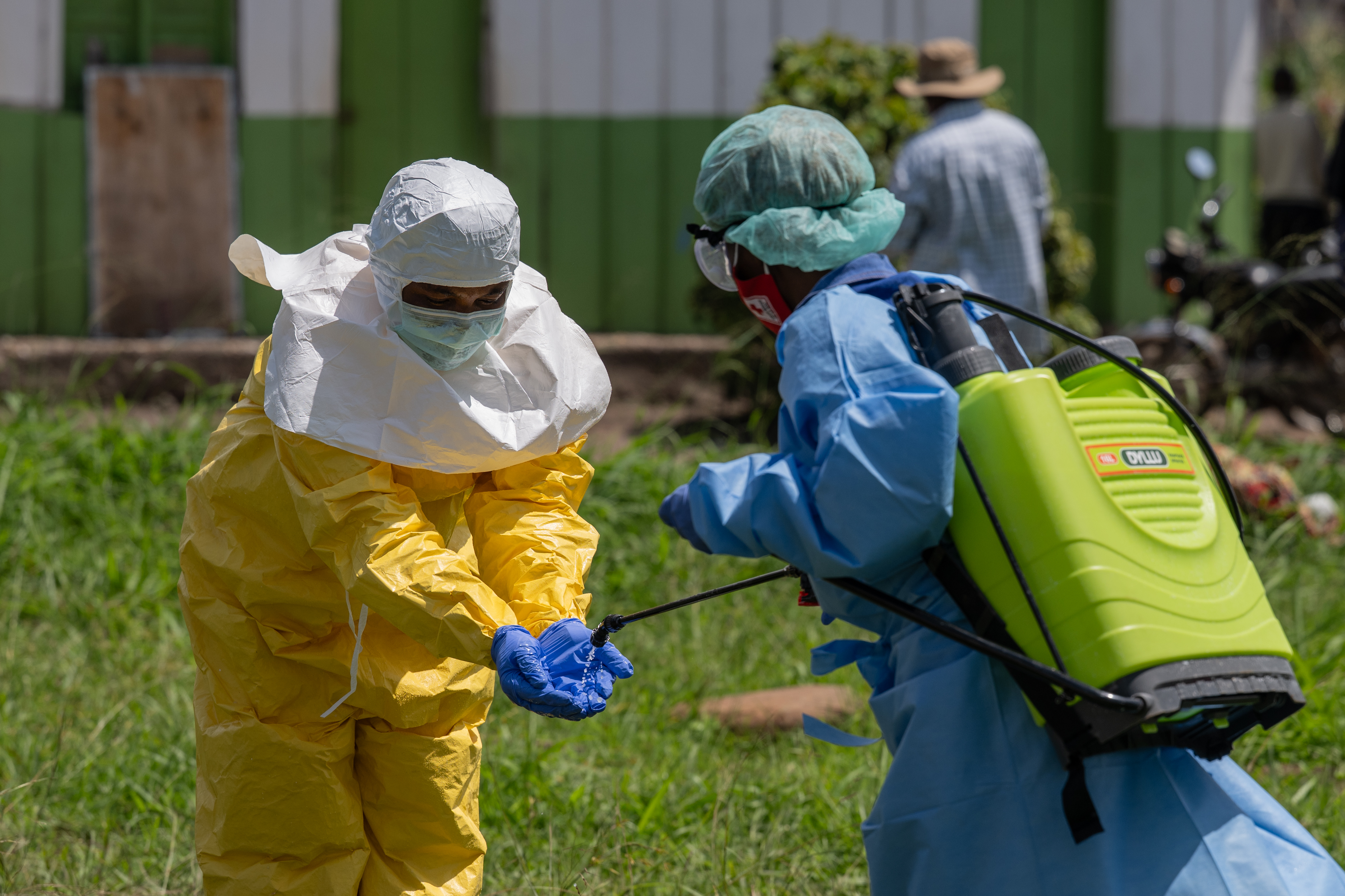 A Red Cross worker disinfects after transporting the bodies of people who died of Ebola in Rwampara, Congo, on Wednesday. (Moses Sawasawa/Ap Photo/Moses Sawasawa)