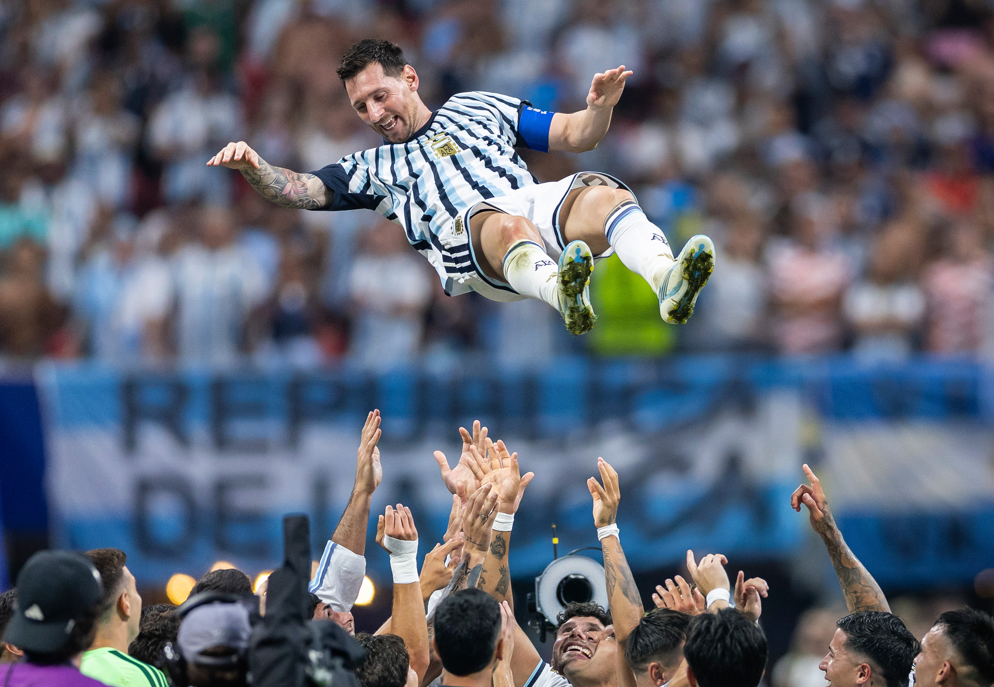 Argentine forward Lionel Messi is thrown into the air by teammates following a 3-2 victory over Egypt in the round of 16. (Justin Setterfield/Getty Images)