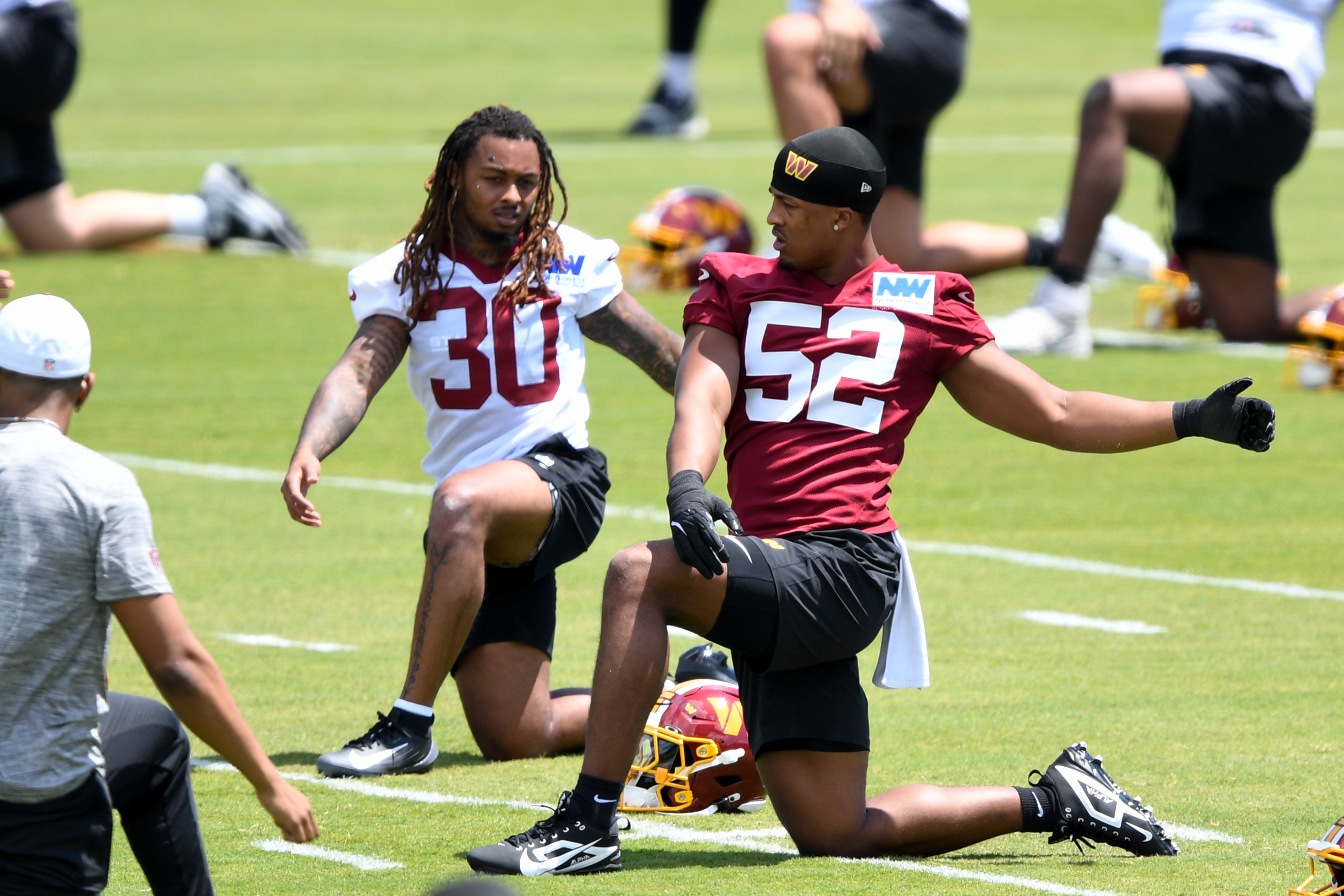Linebacker Sonny Styles, right, made his debut at rookie camp Friday. (Hannah Foslien/For The Washington Post)