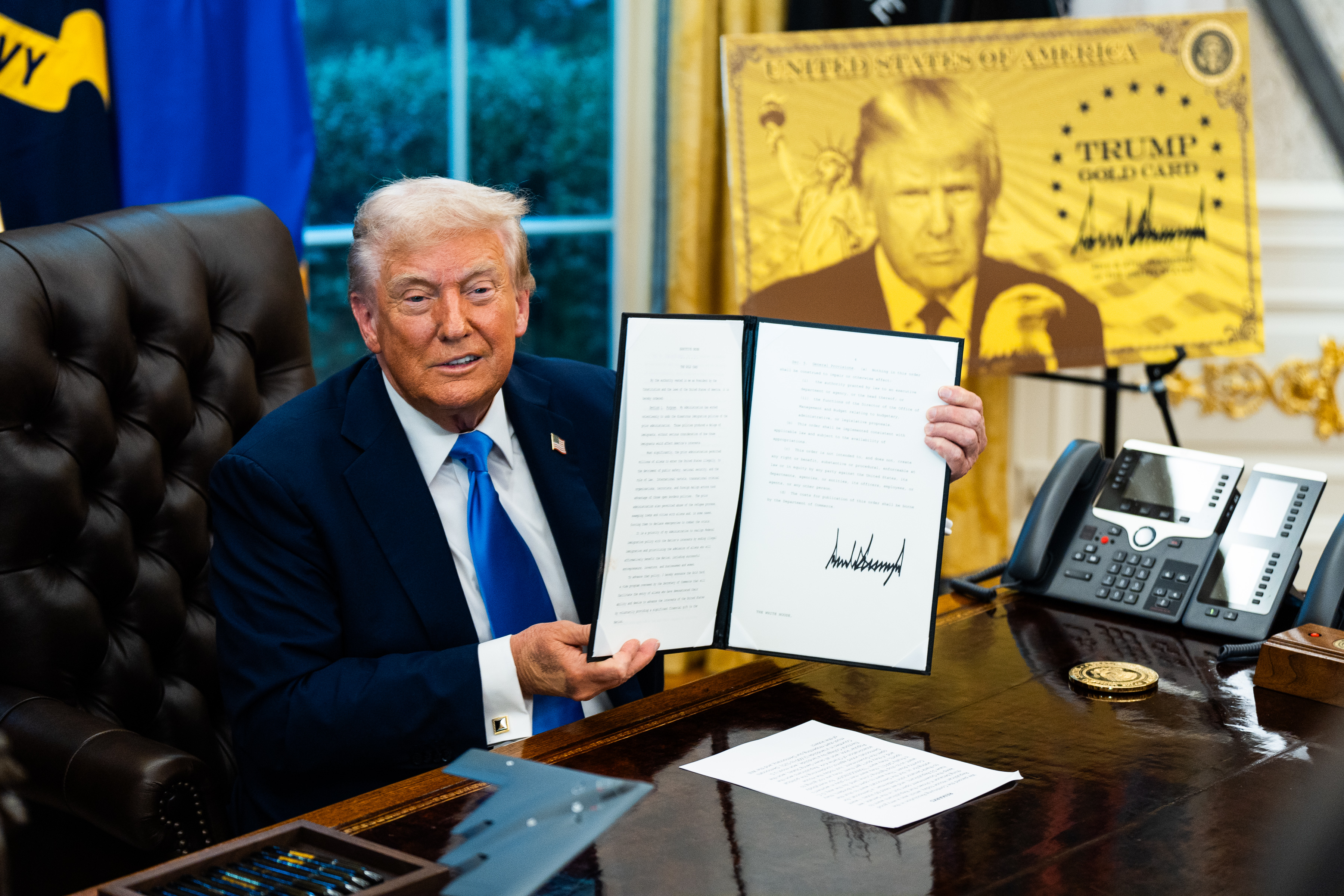 President Donald Trump after signing two executive orders establishing the “Trump Gold Card” visa program and introducing a $100,000 fee for H-1B visas. (Demetrius Freeman/The Washington Post)