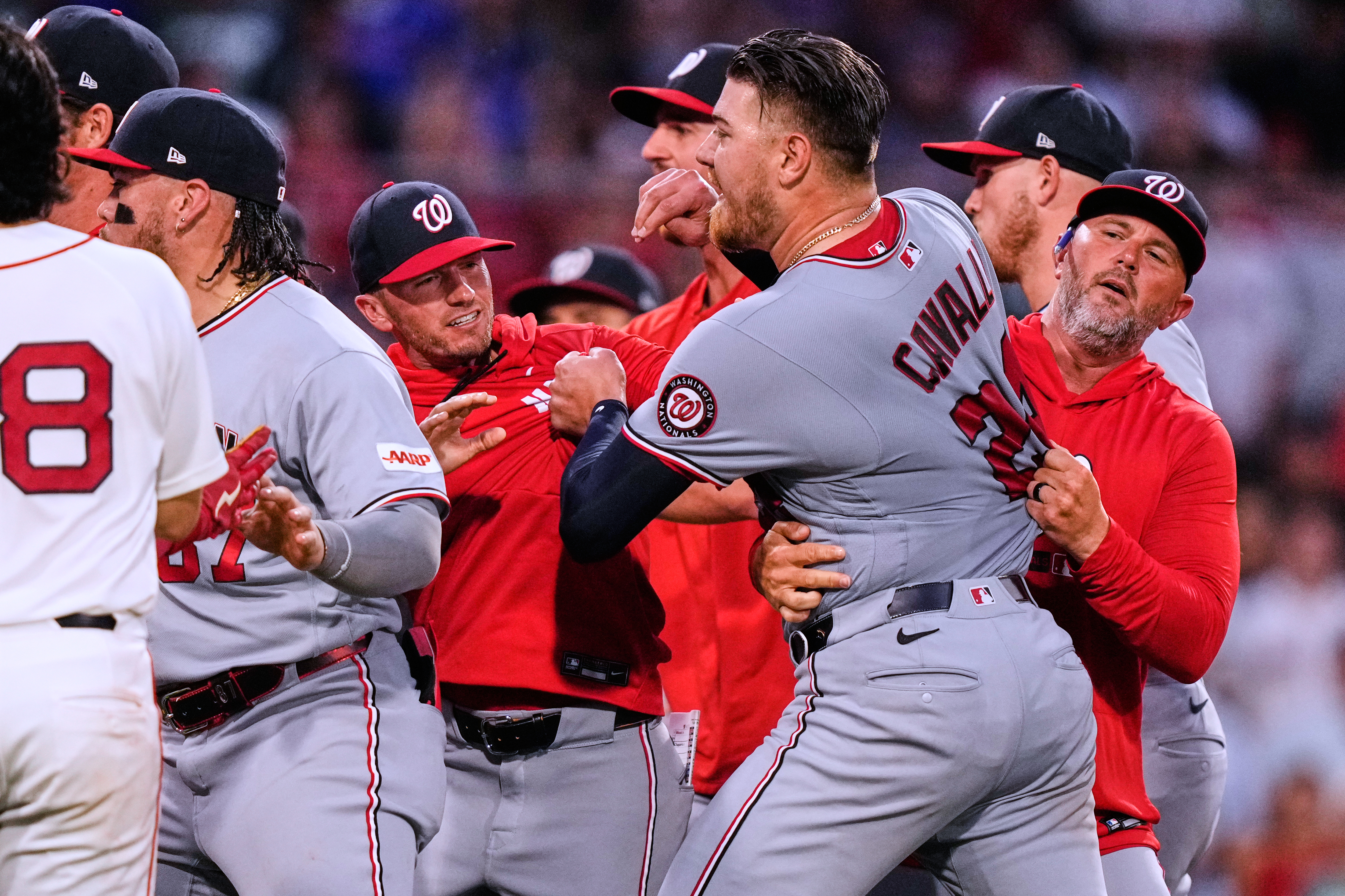 Nationals starter Cade Cavalli is held back as tempers flare during the fourth inning at Fenway Park. (Charles Krupa/Ap Photo/Charles Krupa)
