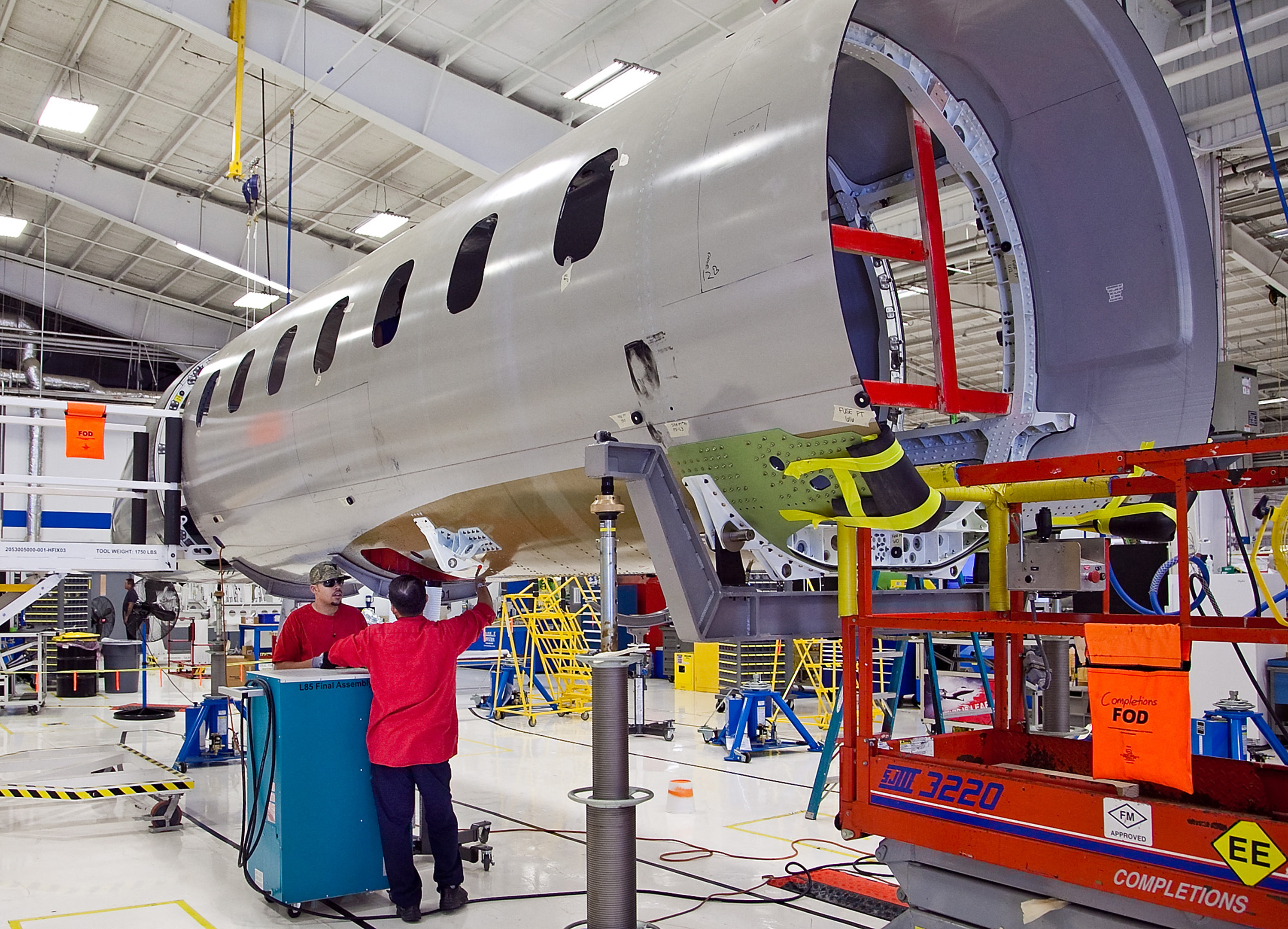 Bombardier Learjet workers with a Model 85 fuselage in Wichita in 2012. (Mike Hutmacher/Wichita Eagle/TNS/ABACA/Reuters)