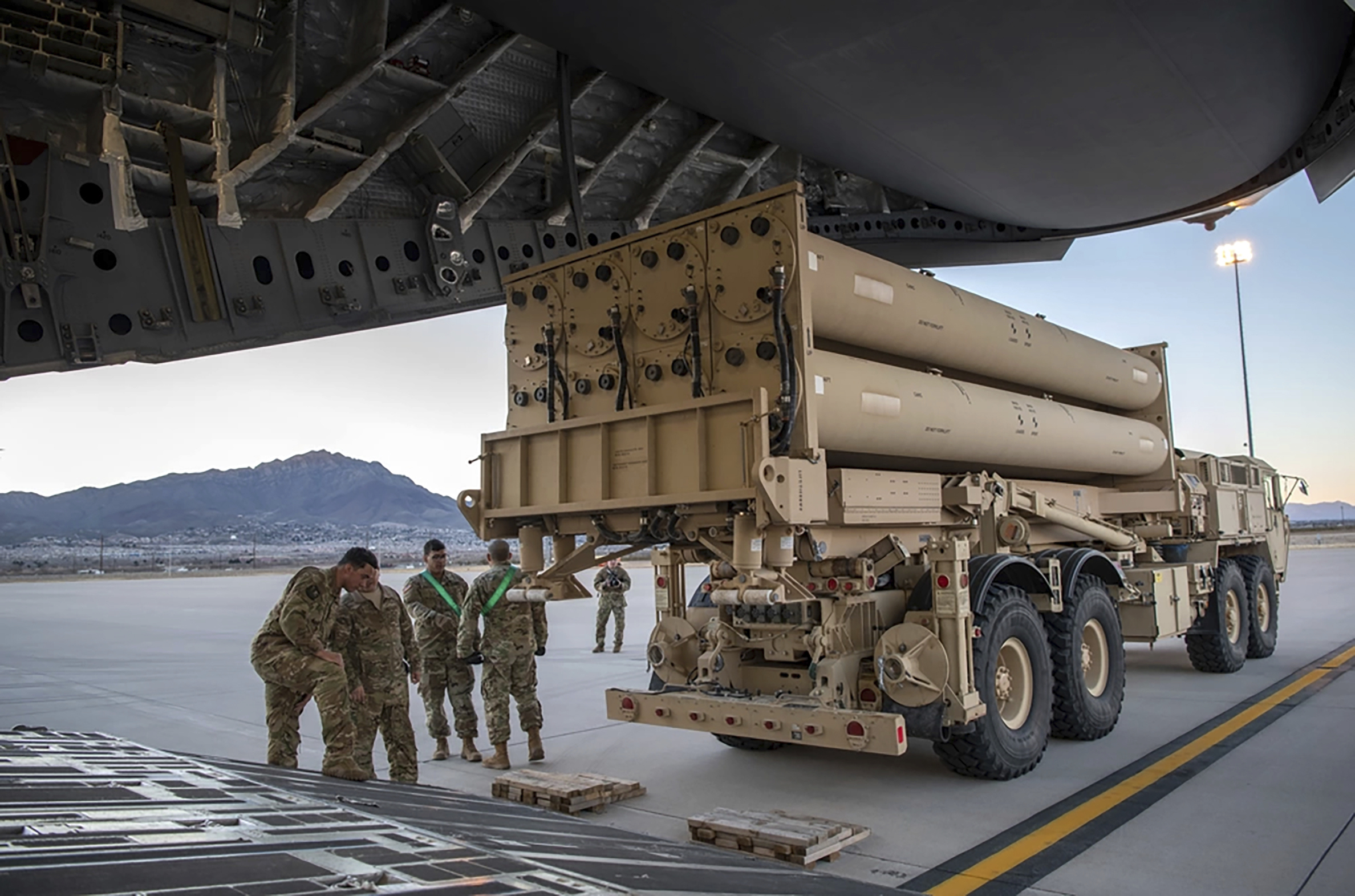 The Terminal High Altitude Area Defense (THAAD) launching station is prepared to load onto a 4th Airlift Squadron C-17 Globemaster III at Fort Bliss, Texas, in 2019. (Staff Sgt. Cory D. Payne/U.S. Air Force/AP)