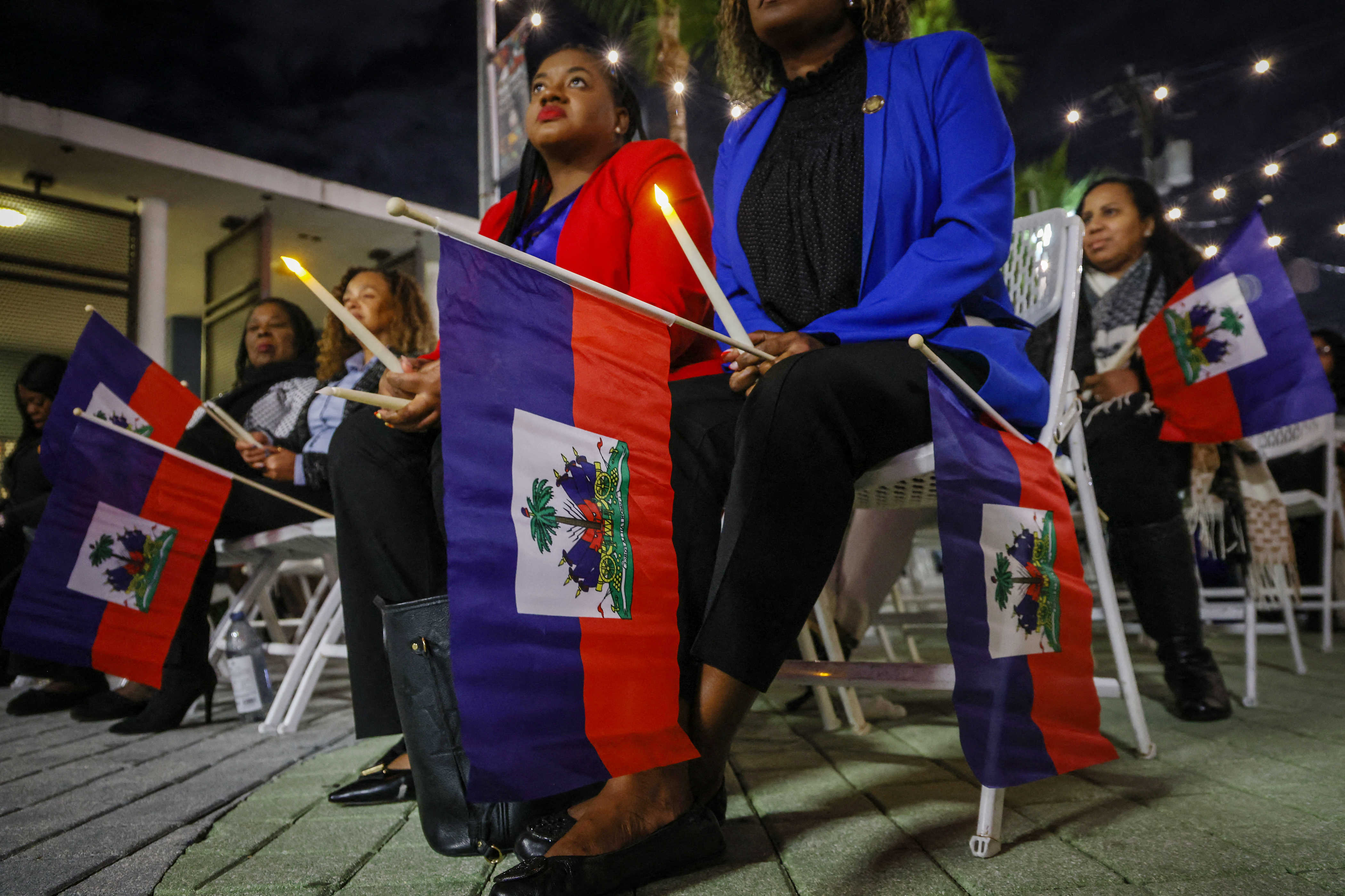 People attend a candlelight vigil in Miami for Haitians with temporary protected status in February. (Giorgio Viera/AFP/Getty Images)