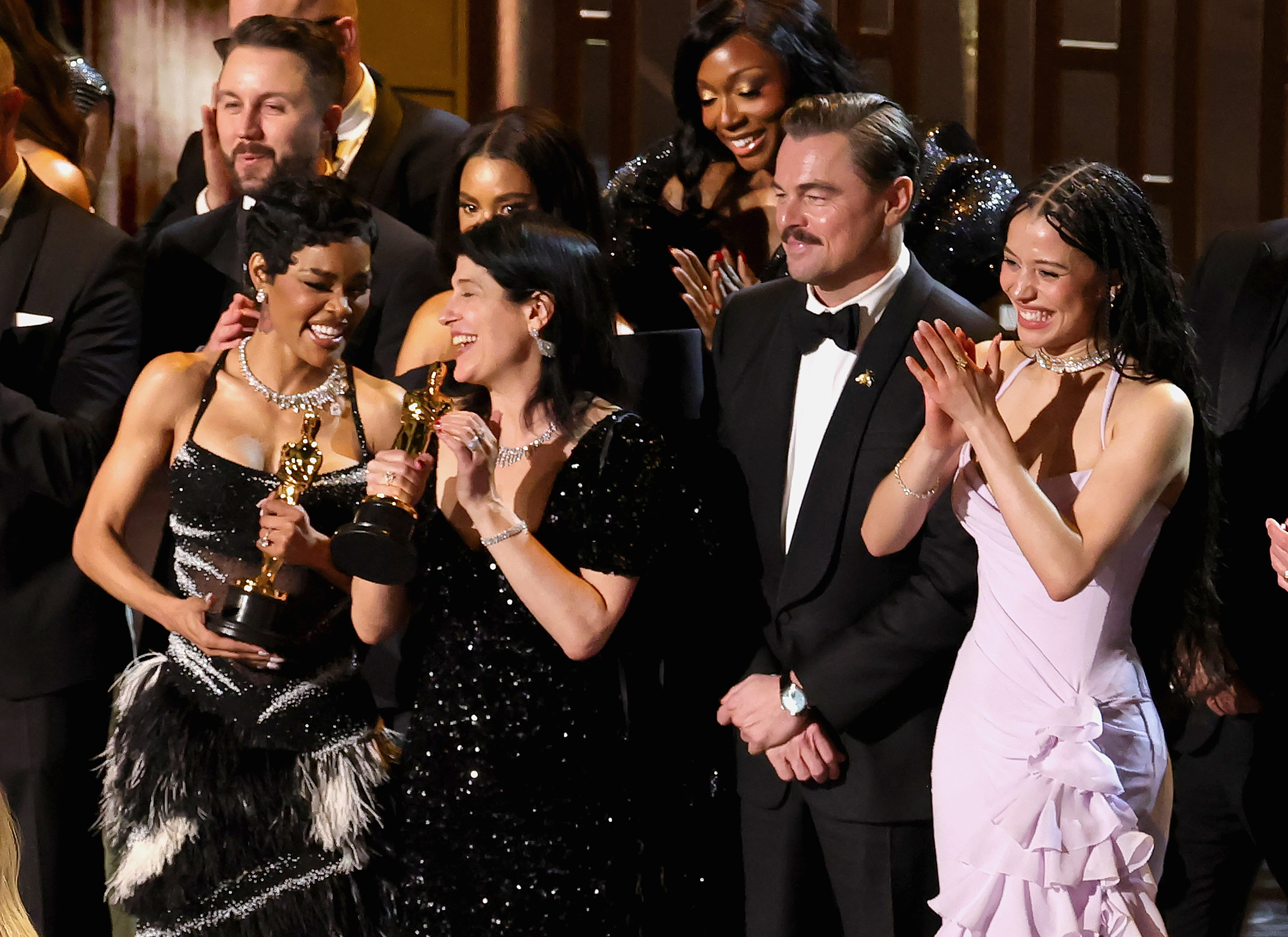 The cast of “One Battle After Another” celebrates after winning the night’s big award. (Getty Images)