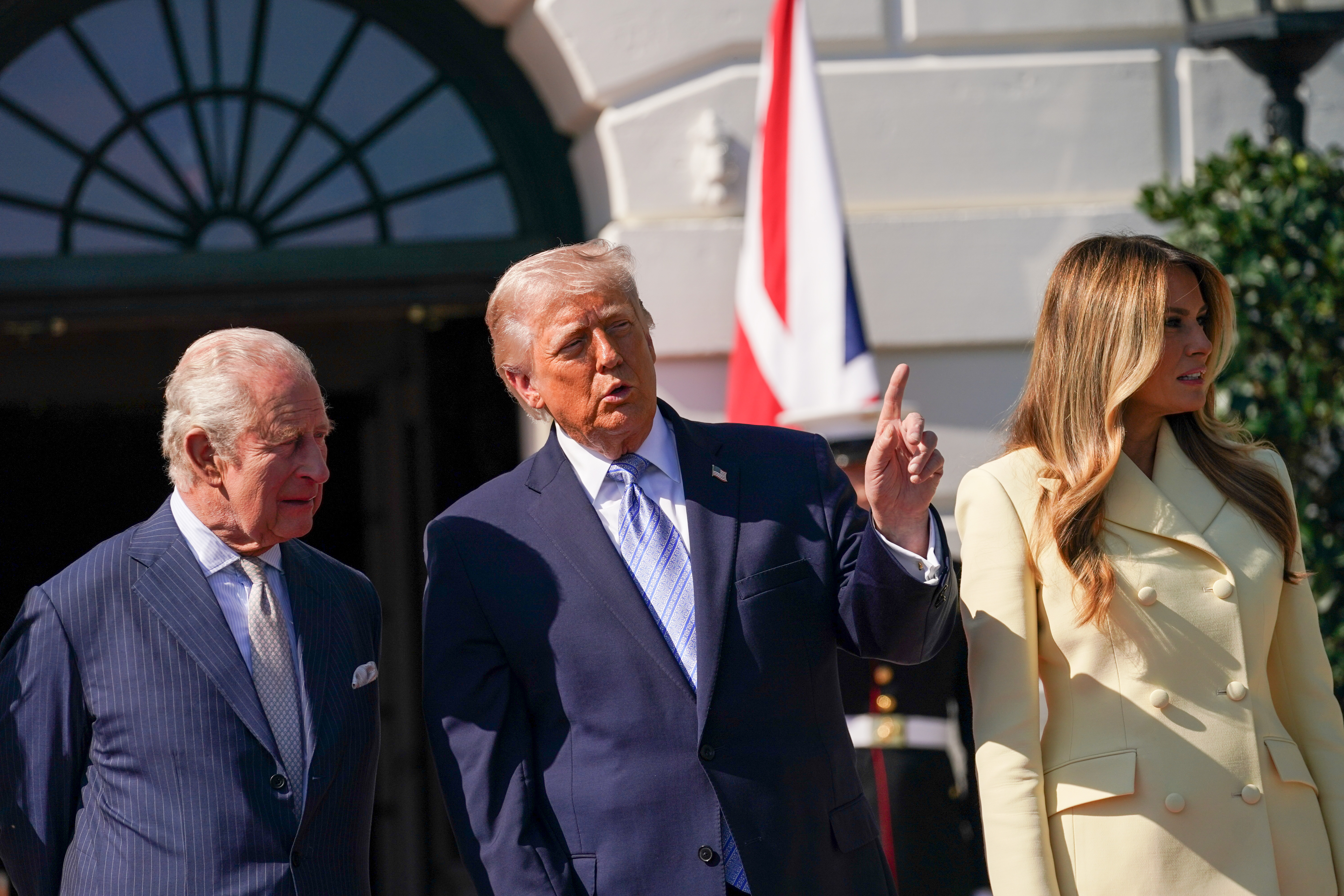 King Charles III, left, is greeted by President Donald Trump and first lady Melania Trump on Monday at the White House. (Allison Robbert/For The Washington Post via Pool)