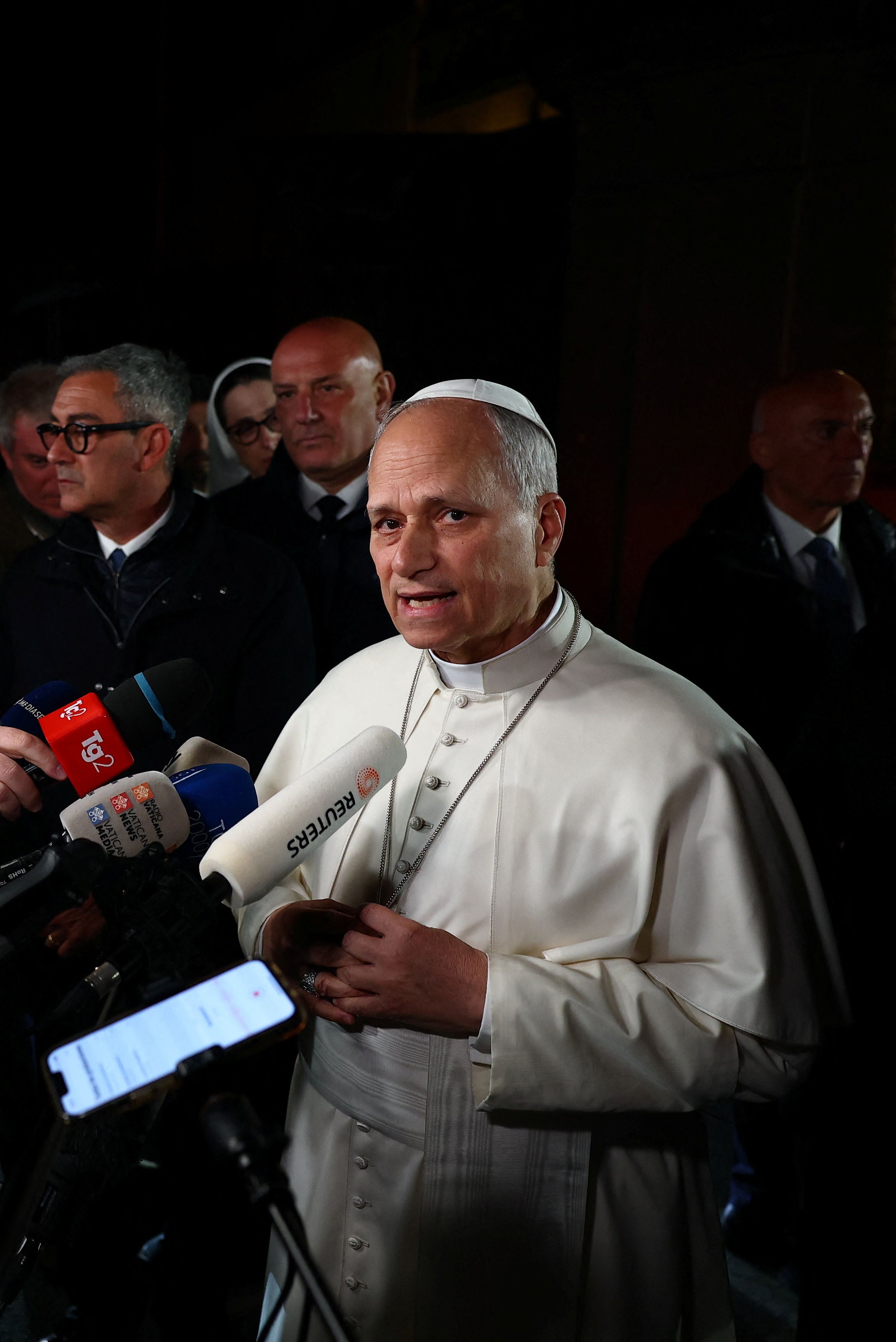 Pope Leo XIV speaks to reporters about the war in Iran Tuesday at Castel Gandolfo, Italy. (Guglielmo Mangiapane/Reuters)