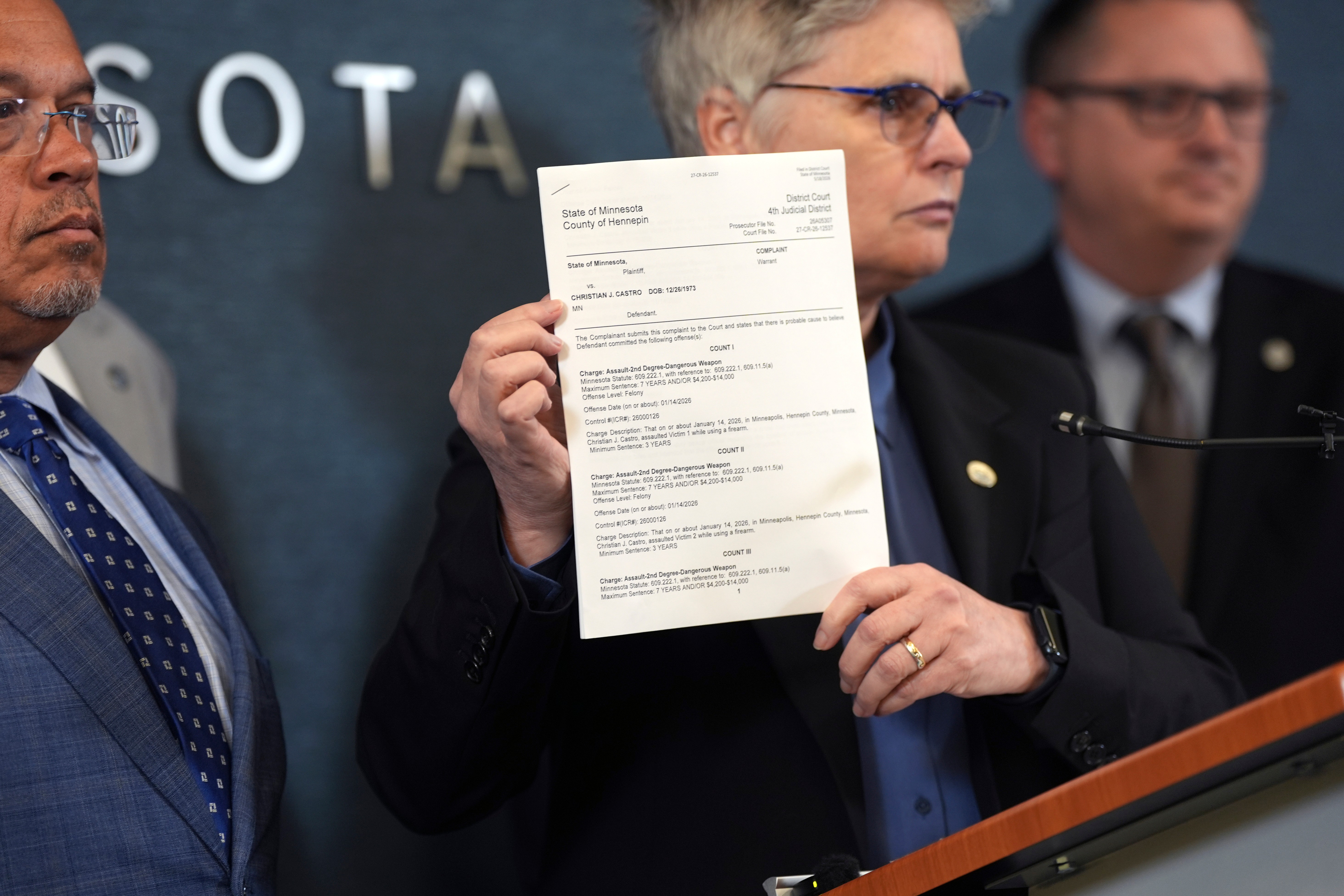 Hennepin County Attorney Mary Moriarty holds up a document showing the charges against ICE agent Christian Castro during a news conference in May. (Renée Jones Schneider/Minnesota Star Tribune)