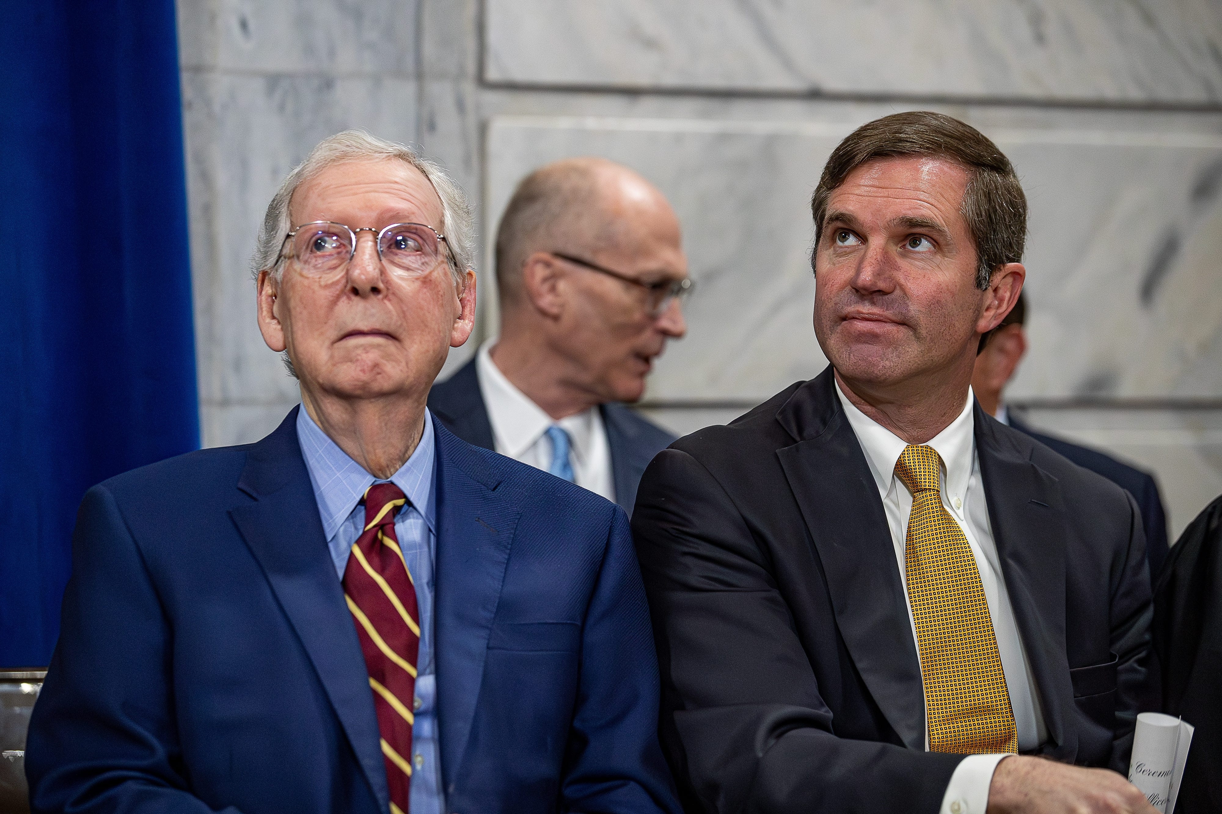 Sen. Mitch McConnell (R-Kentucky), left, and Kentucky Gov. Andy Beshear (D) sit together at the state Capitol in Frankfort in 2024. (Jeff Faughender/Louisville Courier Journal/USA Today Network/Reuters Connect)