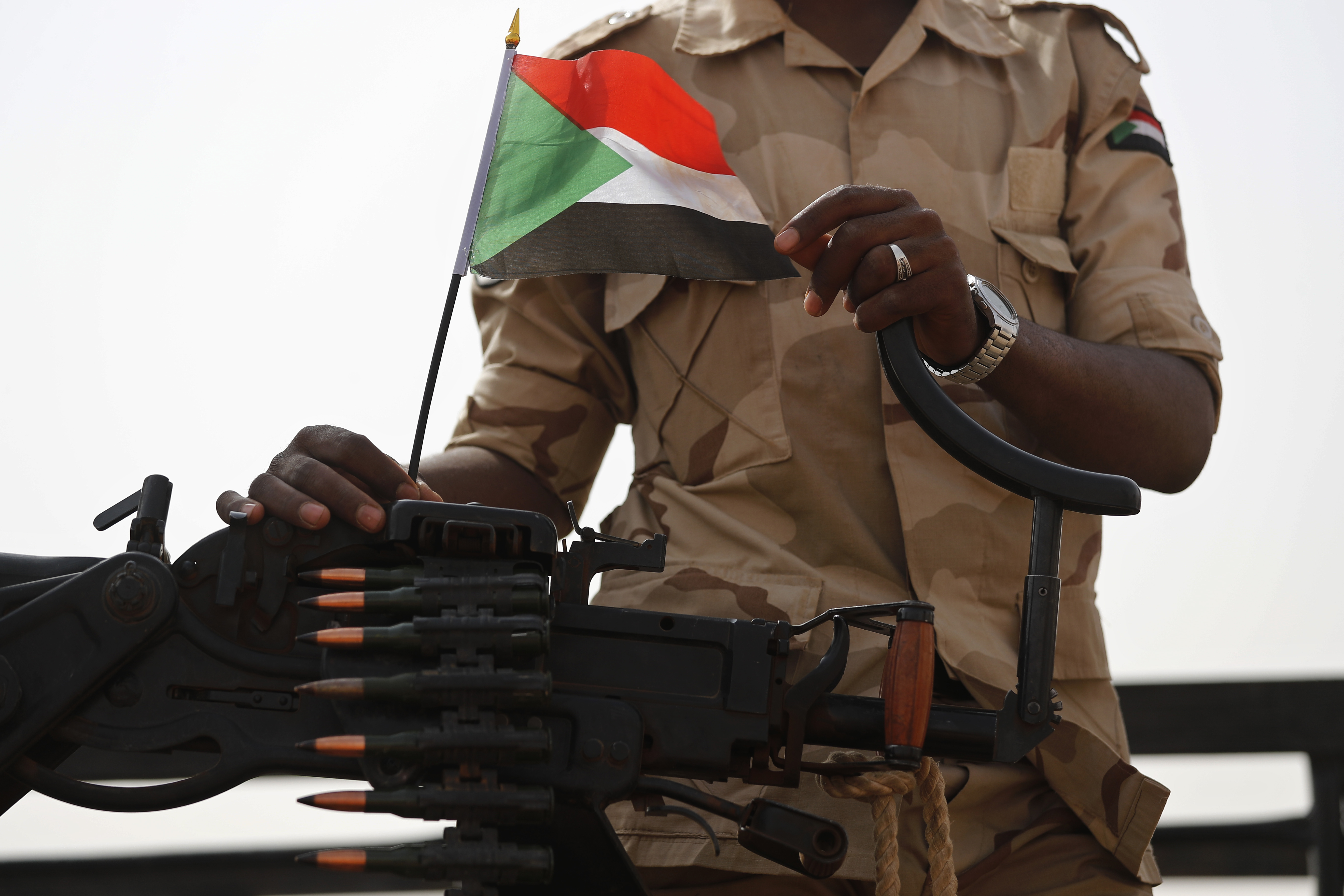A soldier from Sudan's Rapid Support Forces stands on his vehicle in the East Nile district of Sudan in June 2019. (Hussein Malla/AP)