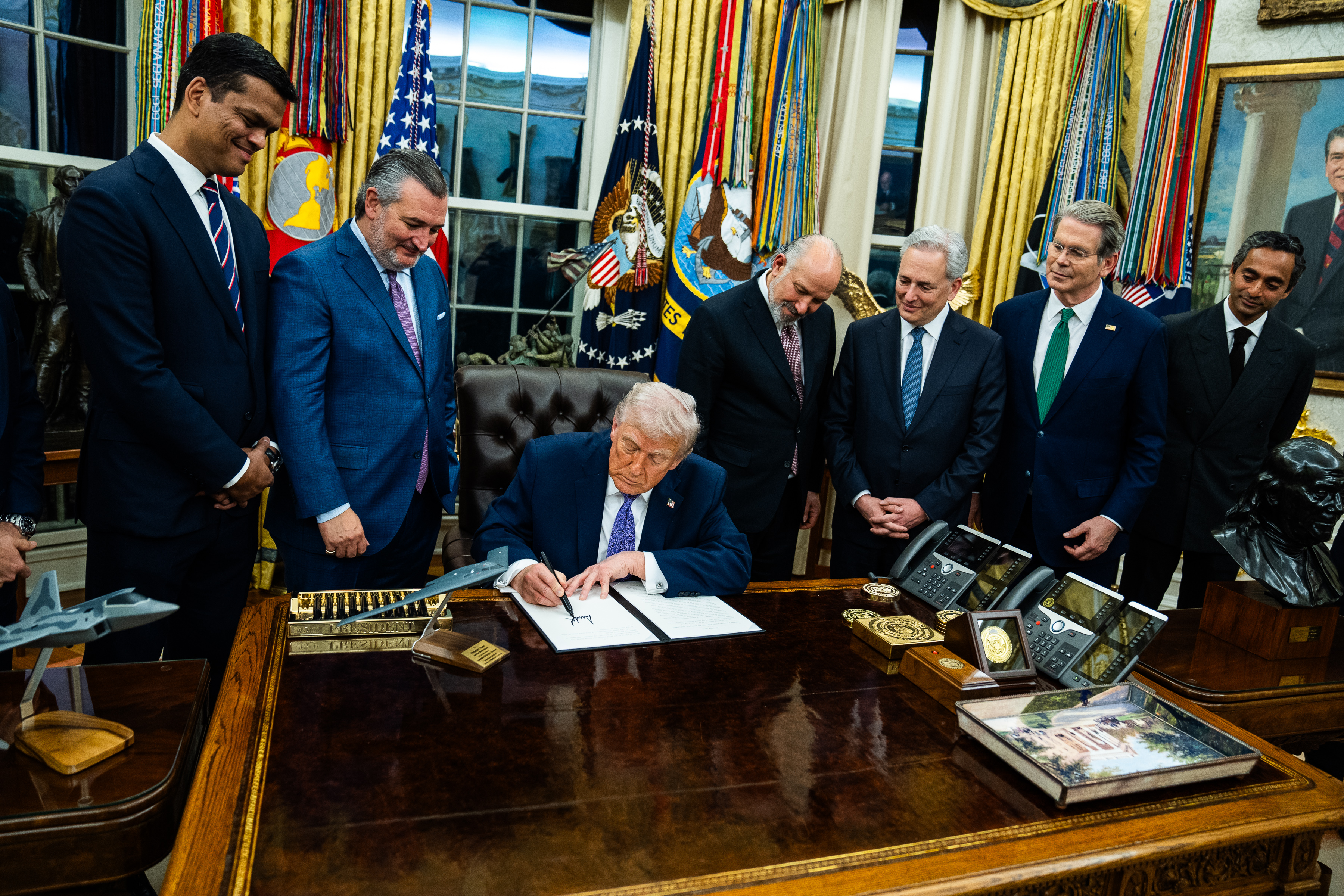 President Donald Trump signs an executive order on artificial intelligence at the White House on Dec. 11. (Demetrius Freeman/The Washington Post)