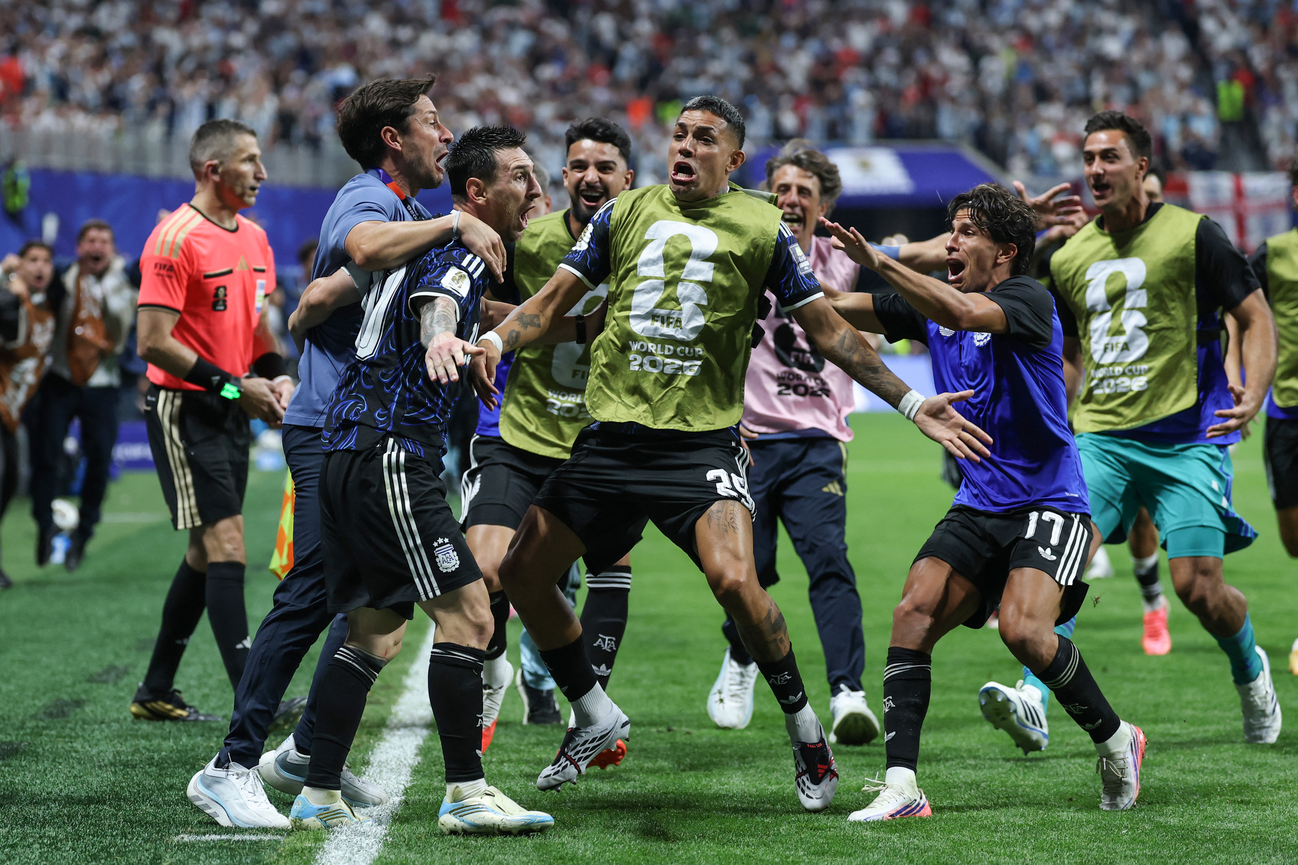Lionel Messi celebrates with teammates after his team's second goal on Wednesday. (Thomas Coex/AFP/Getty Images)