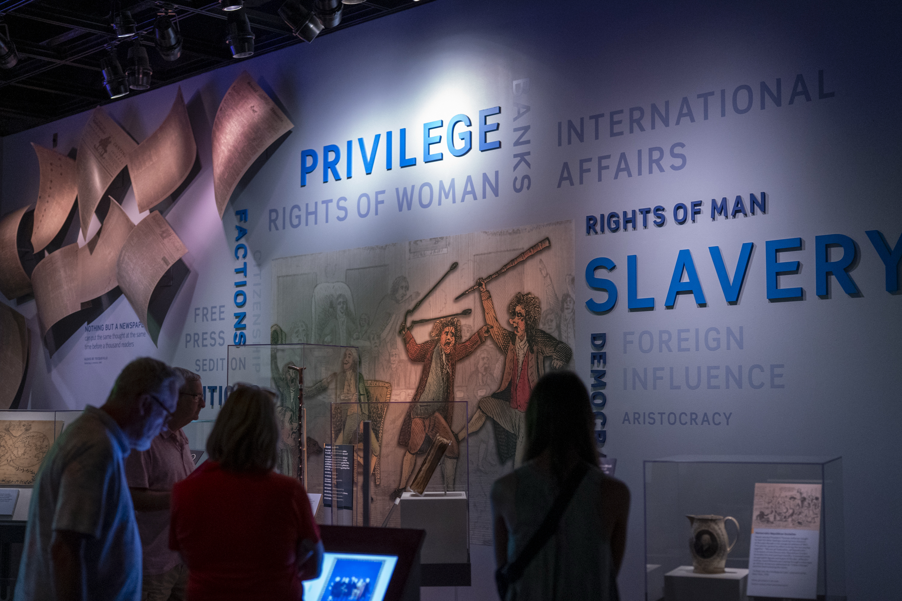 Visitors pass through the “Many Voices, One Nation” exhibition. (Maxine Wallace/The Post)
