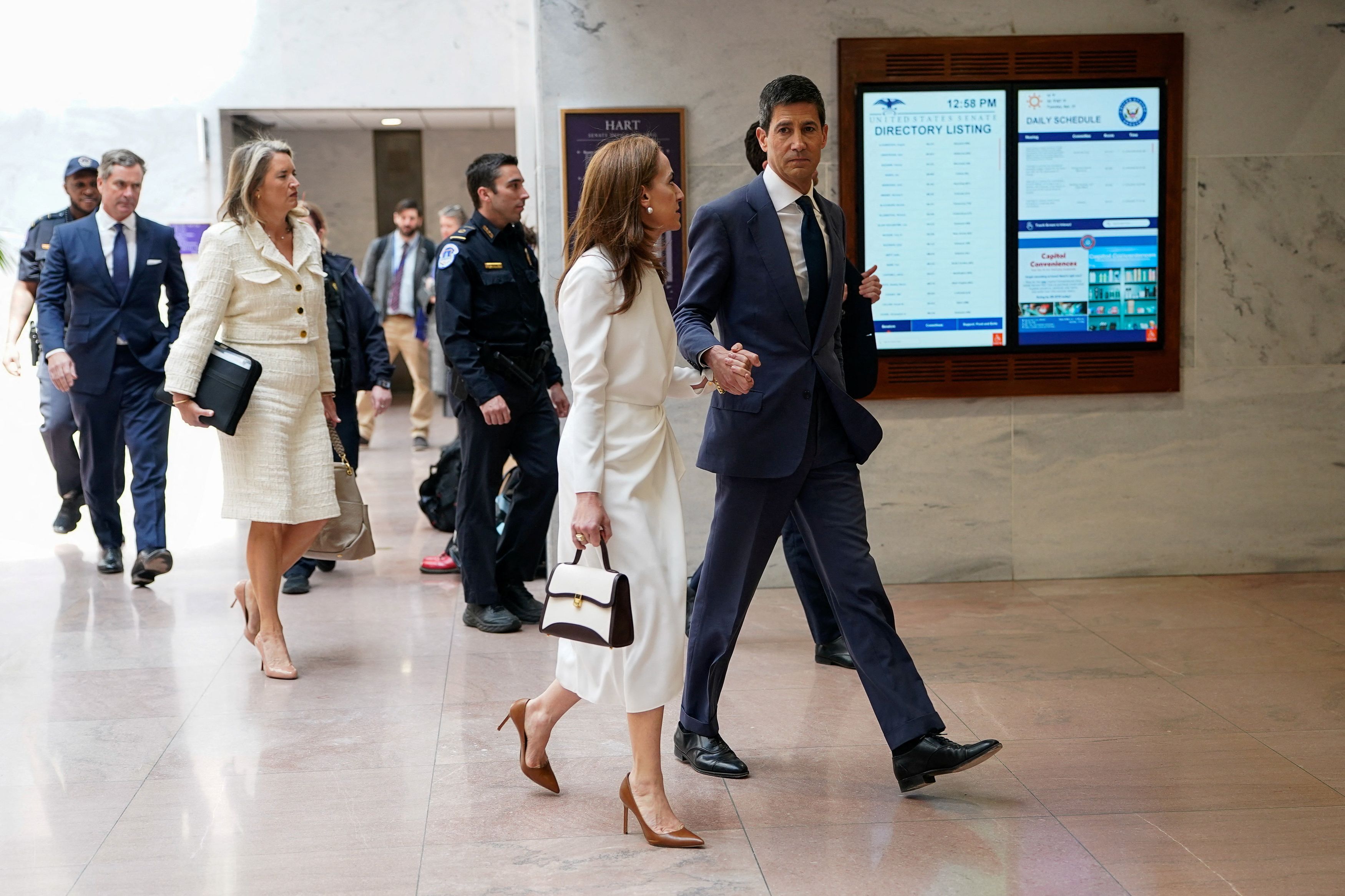 Kevin Warsh leaves his confirmation hearing with his wife, Jane Lauder, last month. (Elizabeth Frantz/Reuters)
