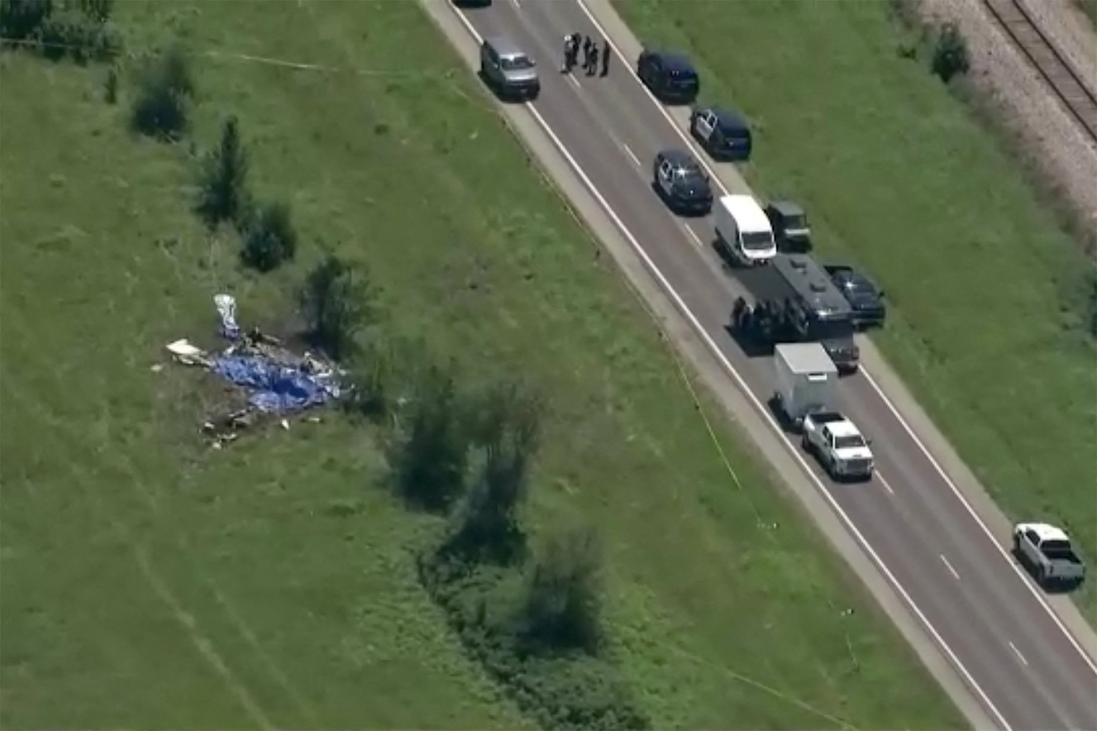 Wreckage lies in a field next to Butler Memorial Airport after a plane carrying skydivers crashed Sunday in Butler, Missouri. (ABC Affiliate KMBC/via REUTERS)