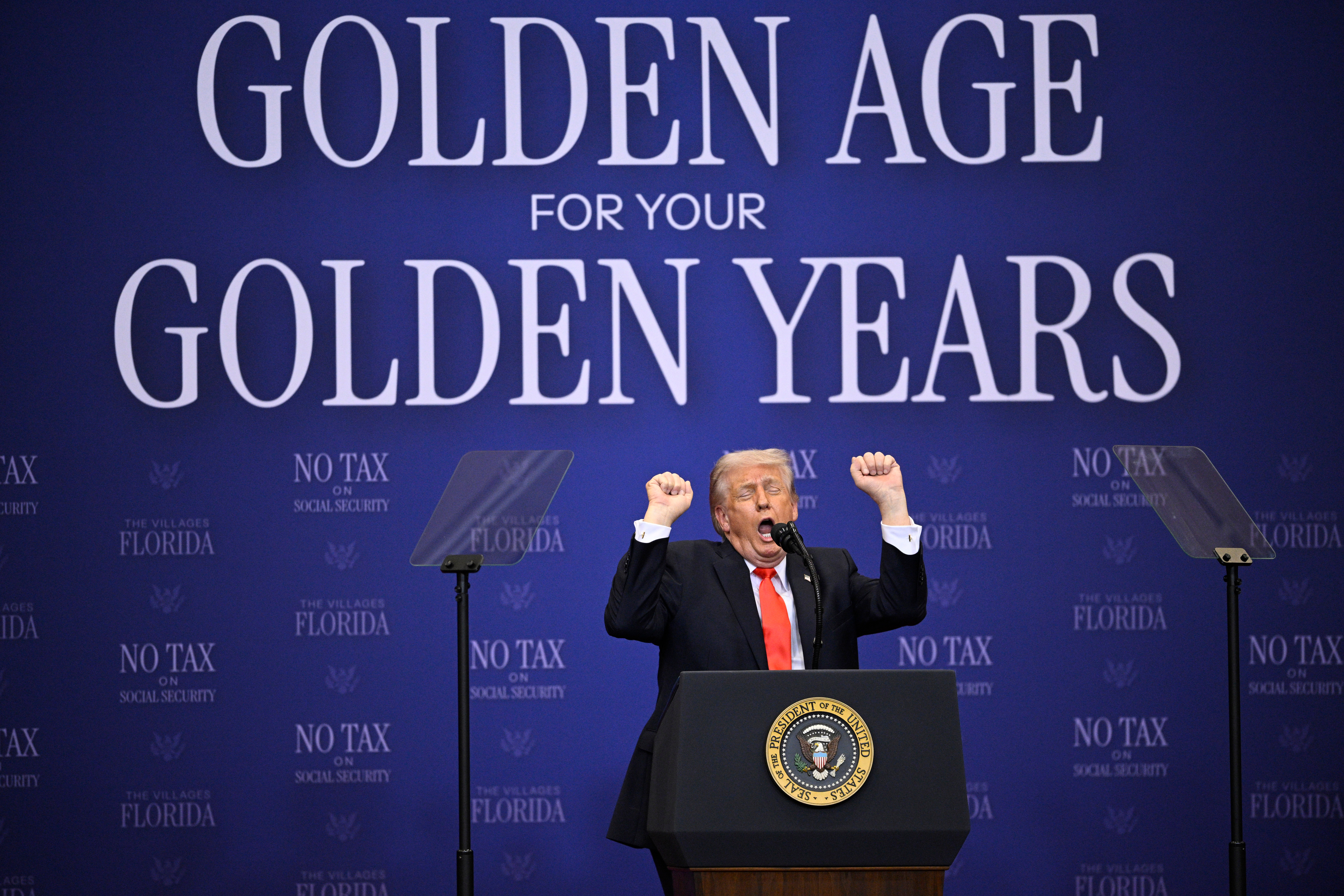 President Donald Trump performs his impression of a transgender weightlifter in a speech at The Villages, Florida. (Phelan M. Ebenhack/AP)