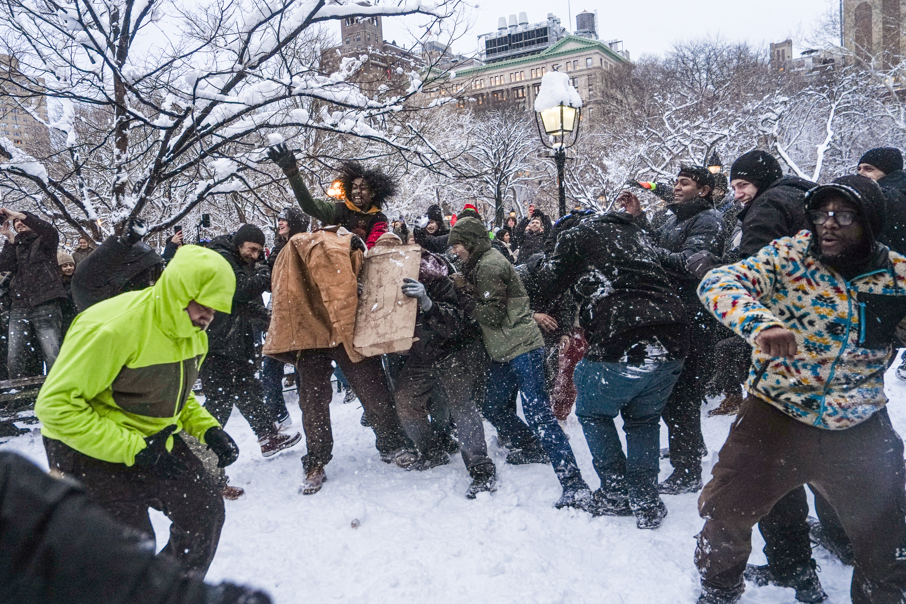 A snowball fight Monday in New York’s Washington Square Park, where some police officers responding to the scene were injured. (Ryan Murphy/Getty Images)