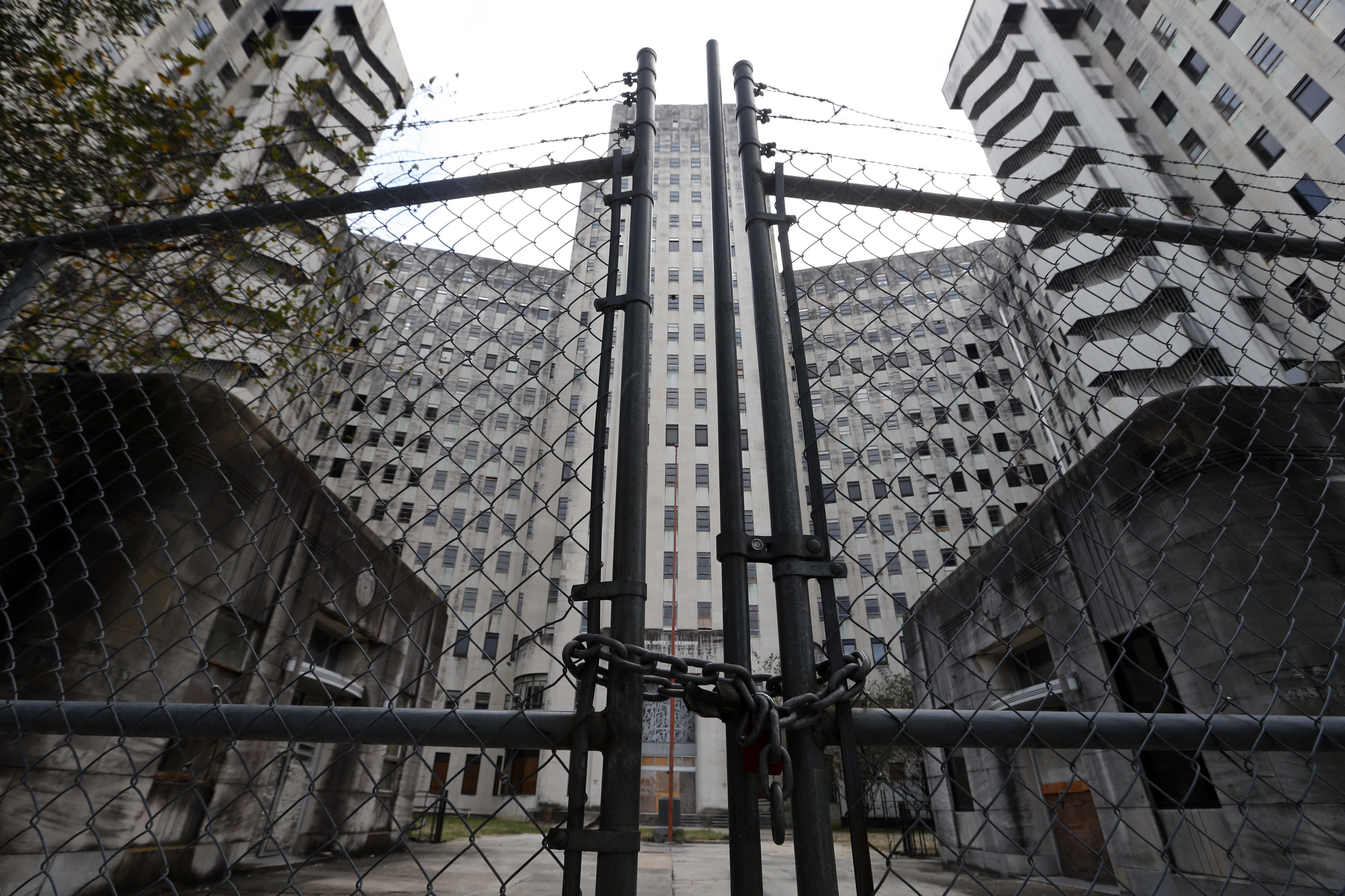 A locked gate at the entrance of the shuttered Charity Hospital building in downtown New Orleans in 2017. (Gerald Herbert/AP)