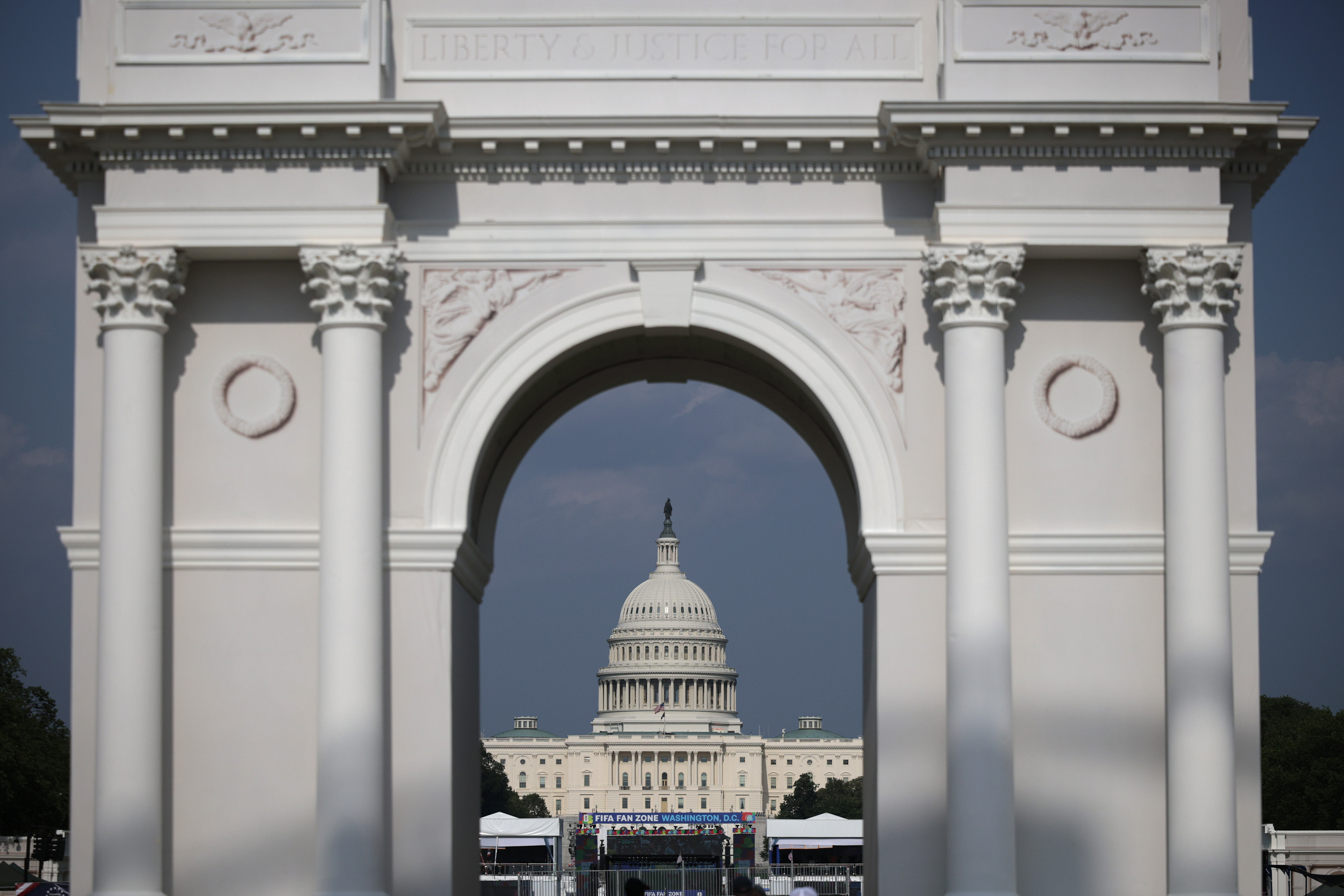 The Capitol is seen through a model of President Donald Trump’s planned triumphal arch during the Great American State Fair on the National Mall in July. (Alex Wong/Getty Images)