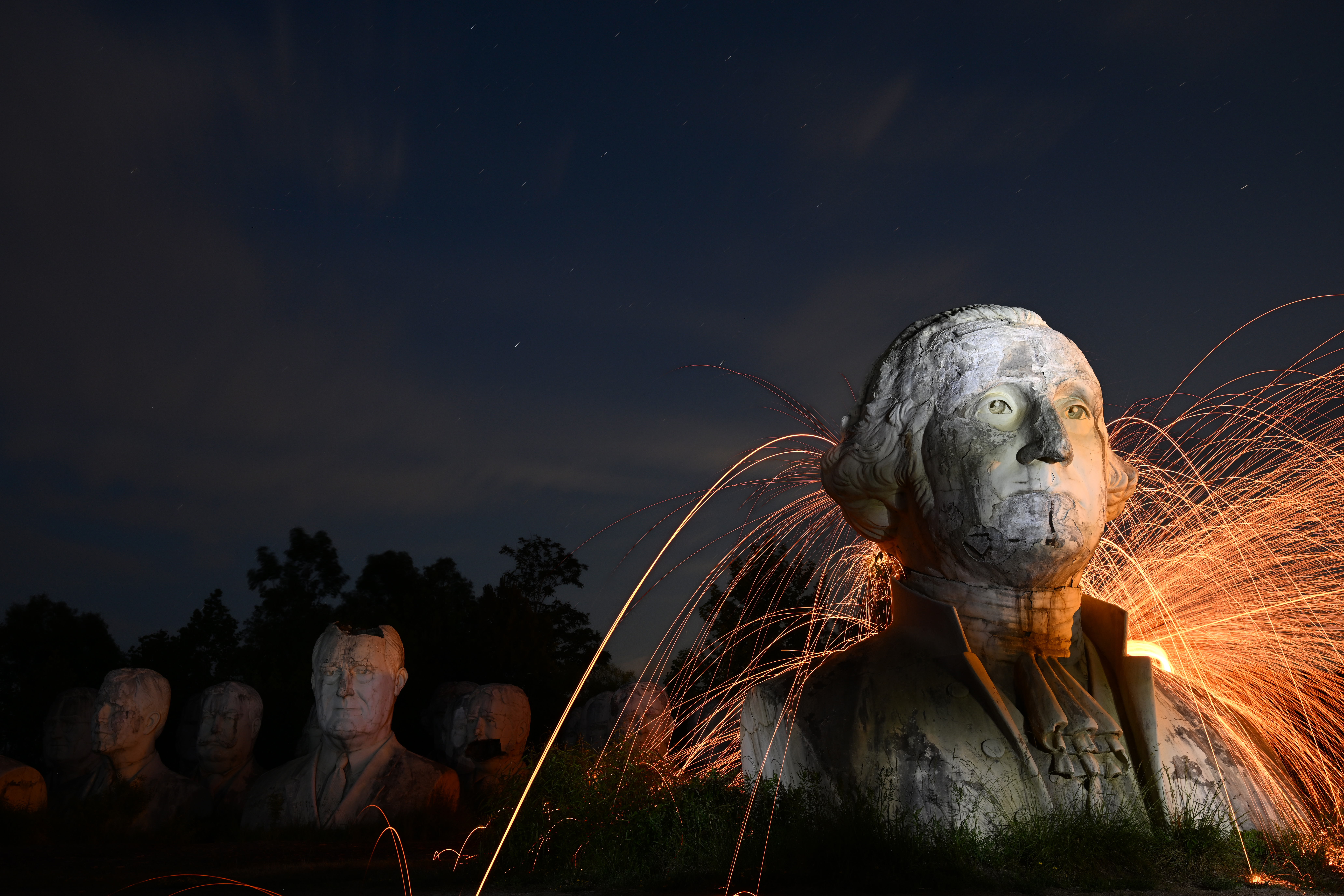 A bust of George Washington is part of a collection of preserved sculptures known as the Presidents Heads, located on private property north of Williamsburg, Virginia.