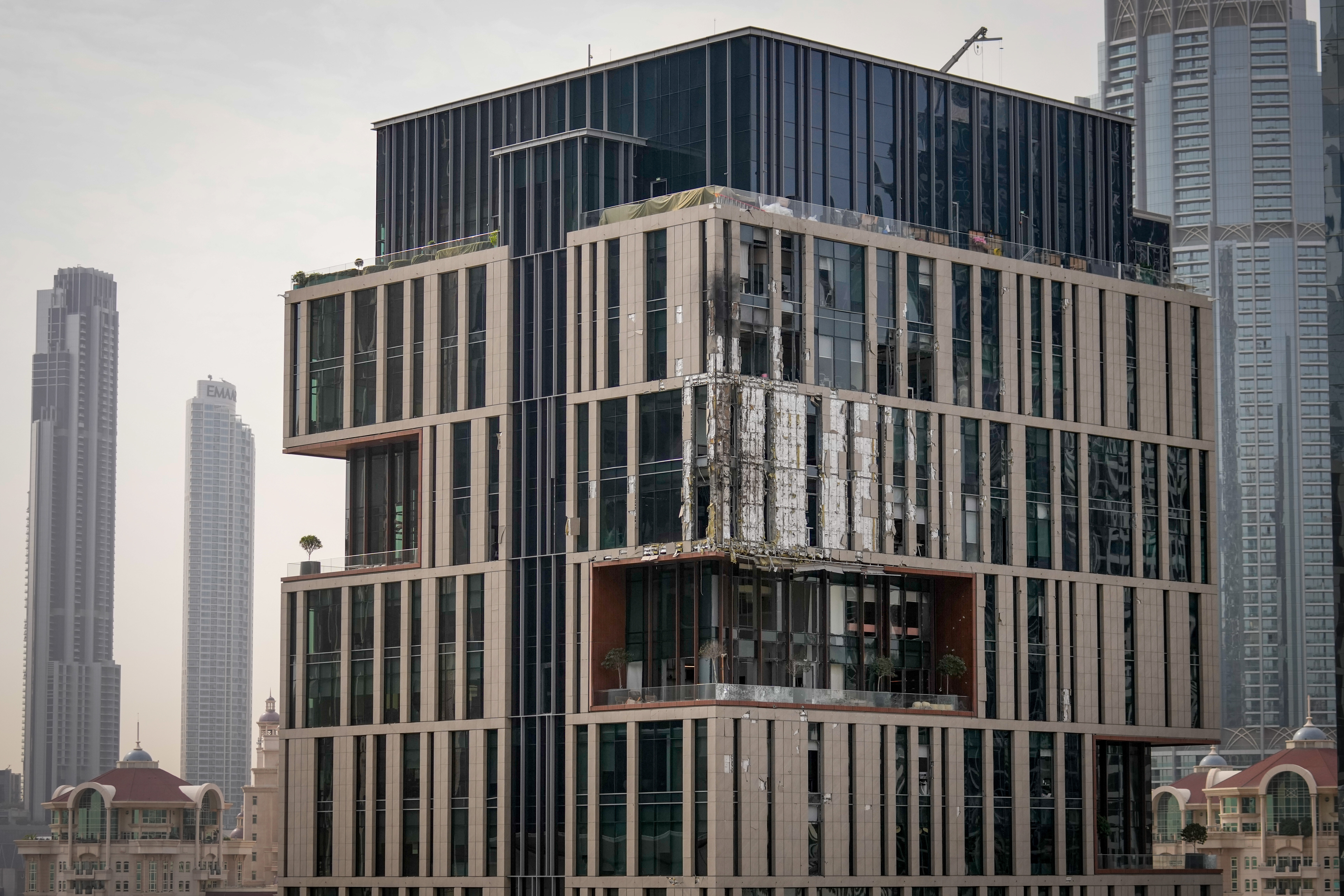 A building in Dubai's financial district was damaged in a drone attack on Friday. (Altaf Qadri/AP)