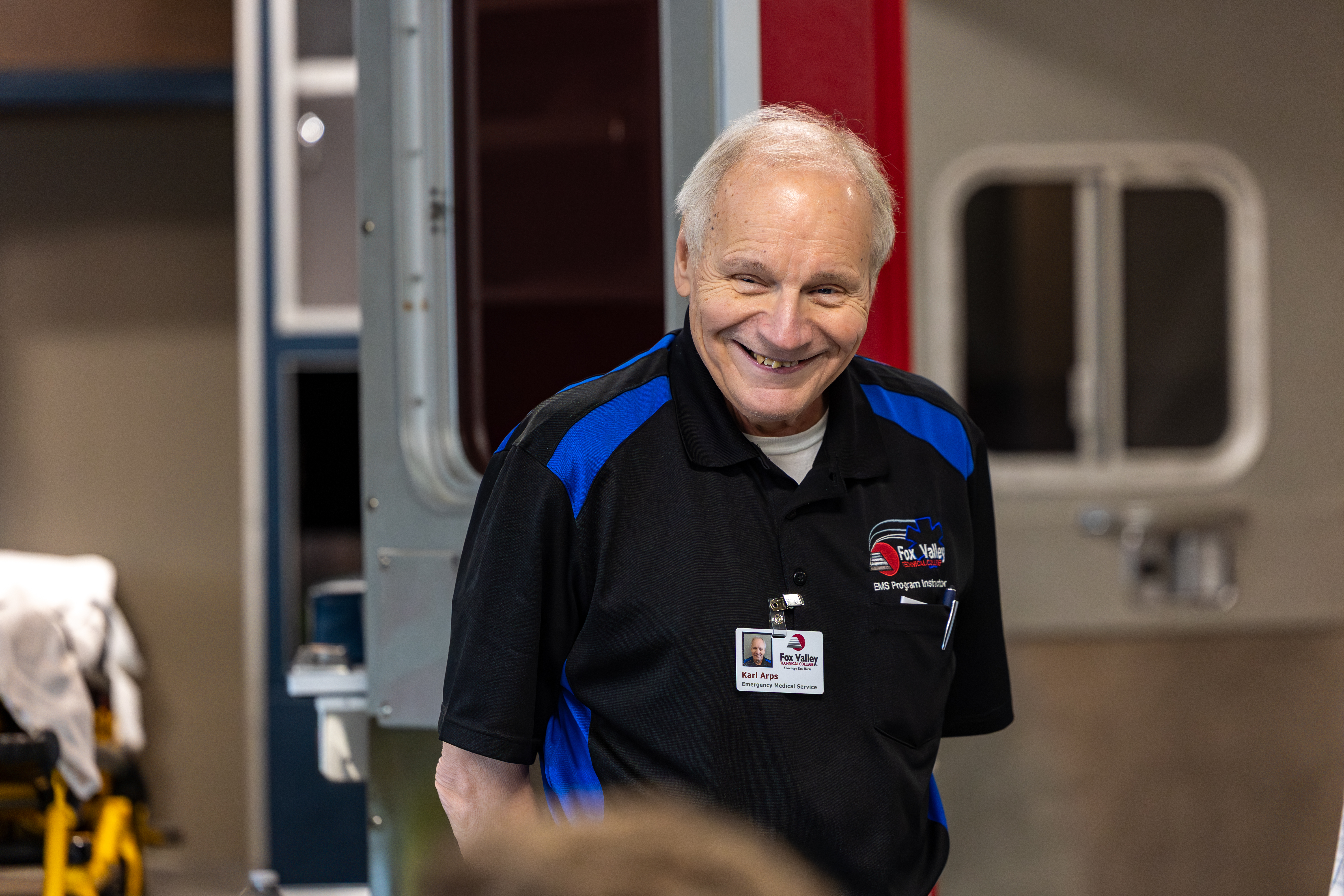 Karl Arps, an EMT instructor at Fox Valley Technical College in Wisconsin, visits with students after he went into cardiac arrest on March 25. During a heart attack simulation for students, Arps experienced a heart attack himself. (Fox Valley Technical College)
