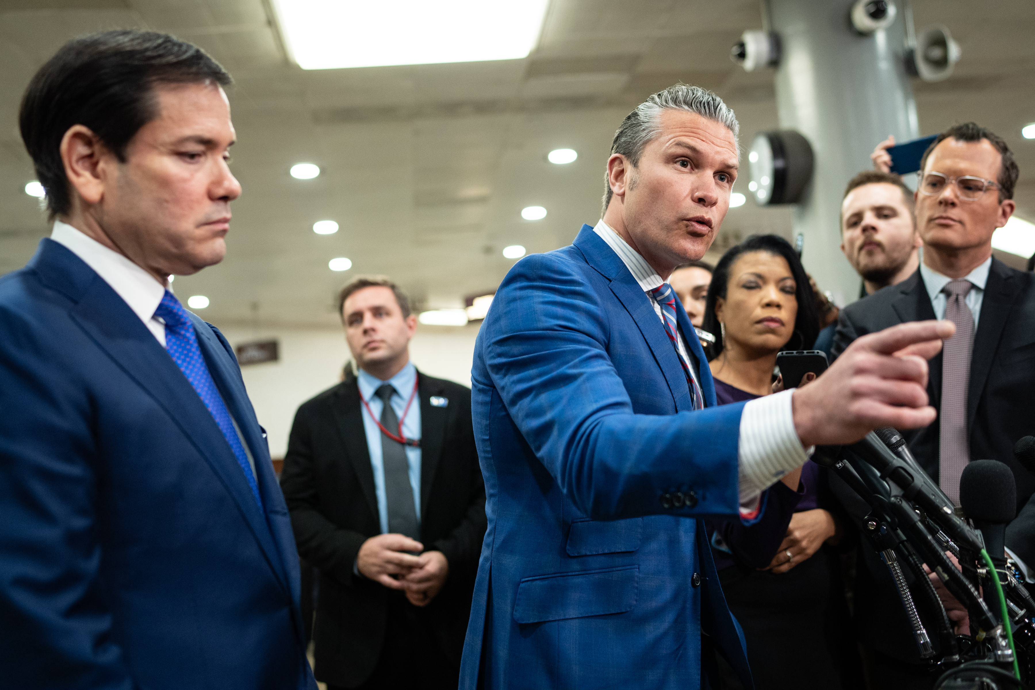 Secretary of State Marco Rubio, left, and Defense Secretary Pete Hegseth face reporters on Capitol Hill last month. (Sarah L. Voisin/The Washington Post)
