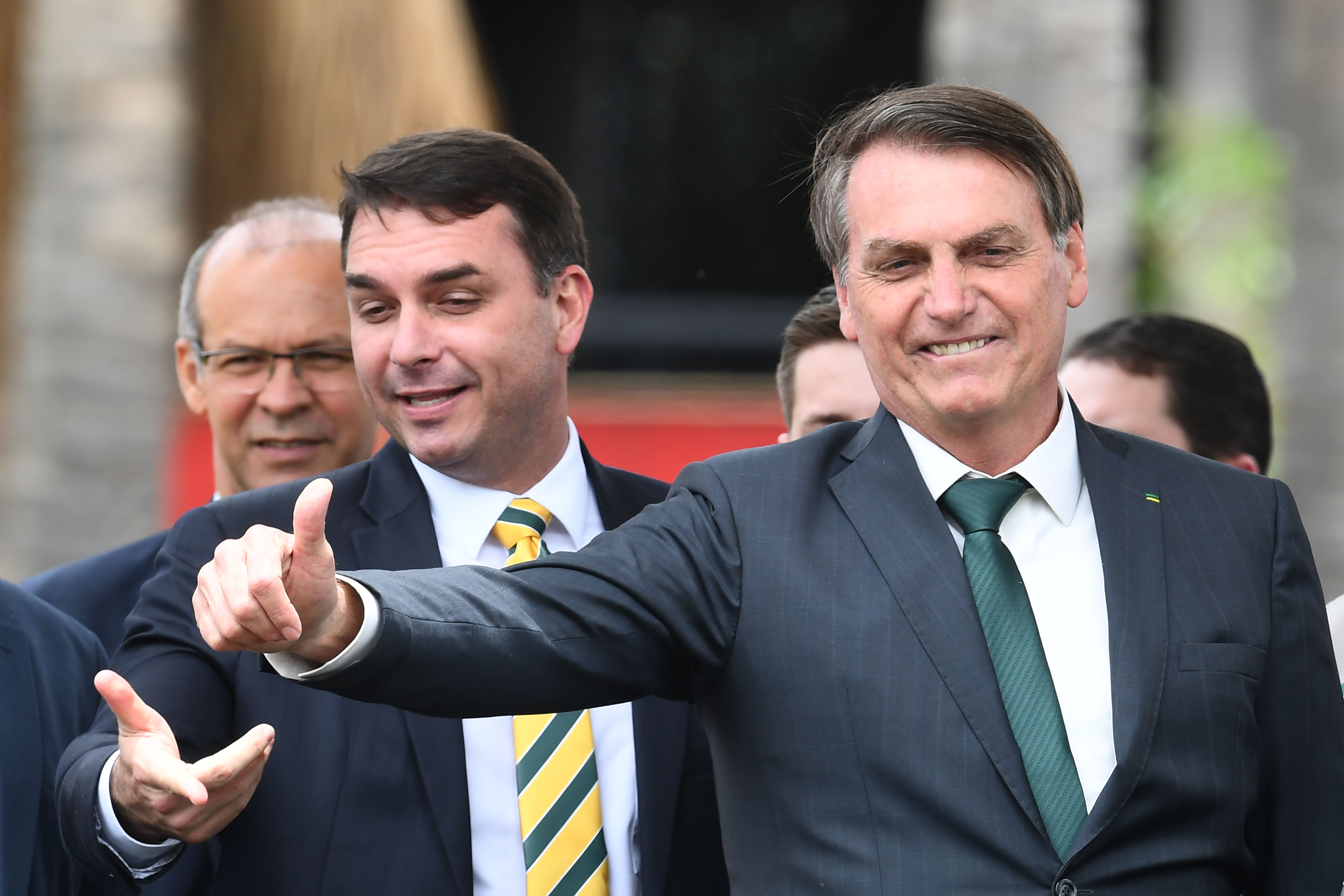 Brazilian President Jair Bolsonaro, right, and his oldest son, Senator Flávio Bolsonaro, launch the ultimately short-lived Alliance for Brazil party in Brasília in 2019. (Evaristo Sa/AFP/Getty Images)