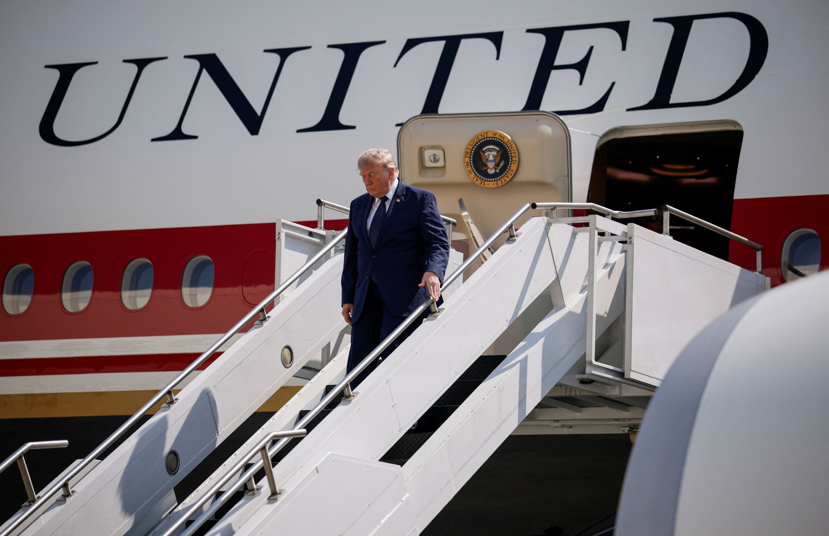 President Donald Trump disembarks the new Qatari-gifted Air Force One in New York on Friday. The Justice Department had issued subpoenas to New York Times journalists over reporting on the jet. (Evan Vucci/Reuters)