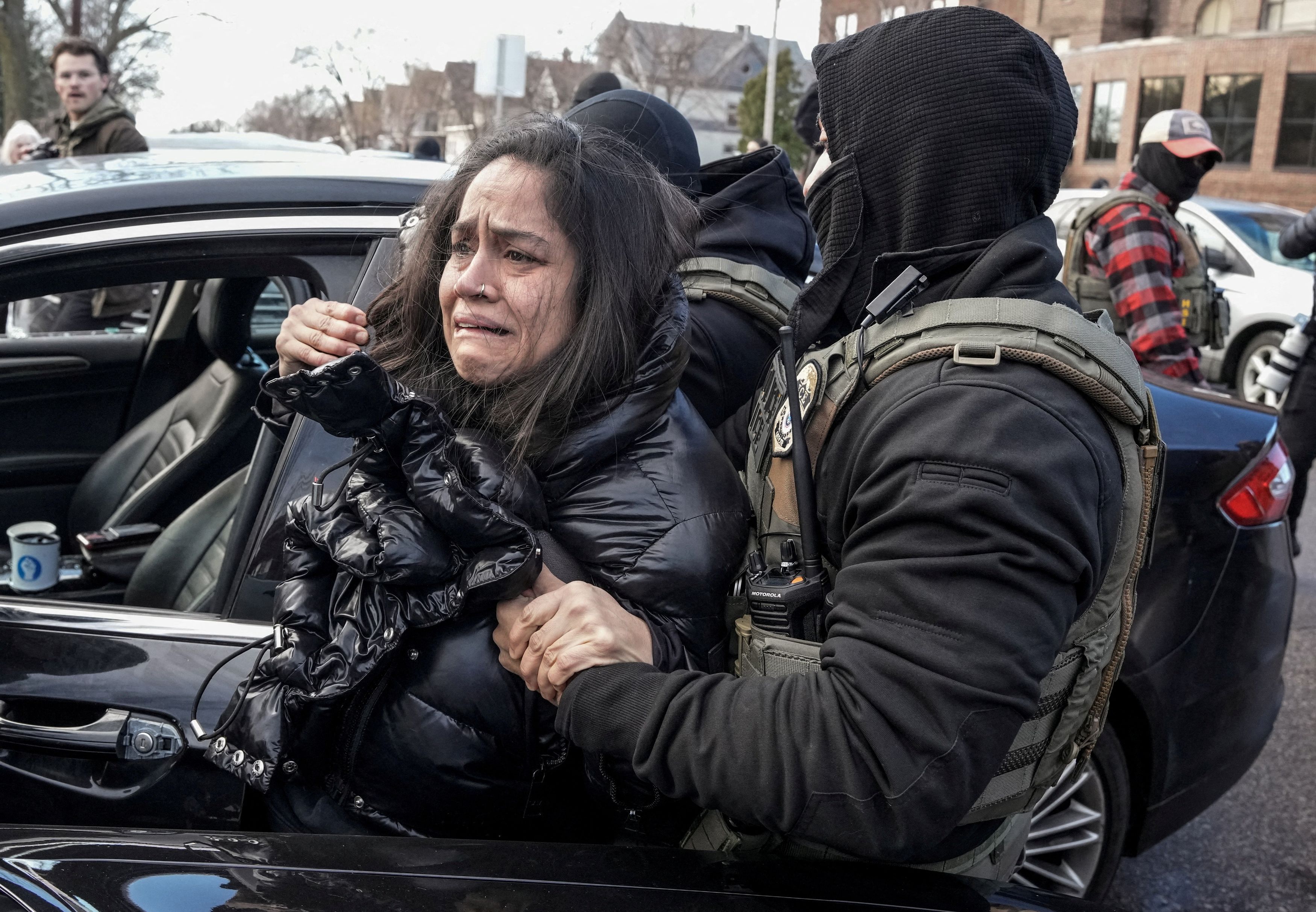 Aliya Rahman, a U.S. citizen, was forcefully removed from her car by immigration enforcement agents in January as part of the Trump administration’s crackdown on alleged undocumented immigrants. (Tim Evans/Reuters)