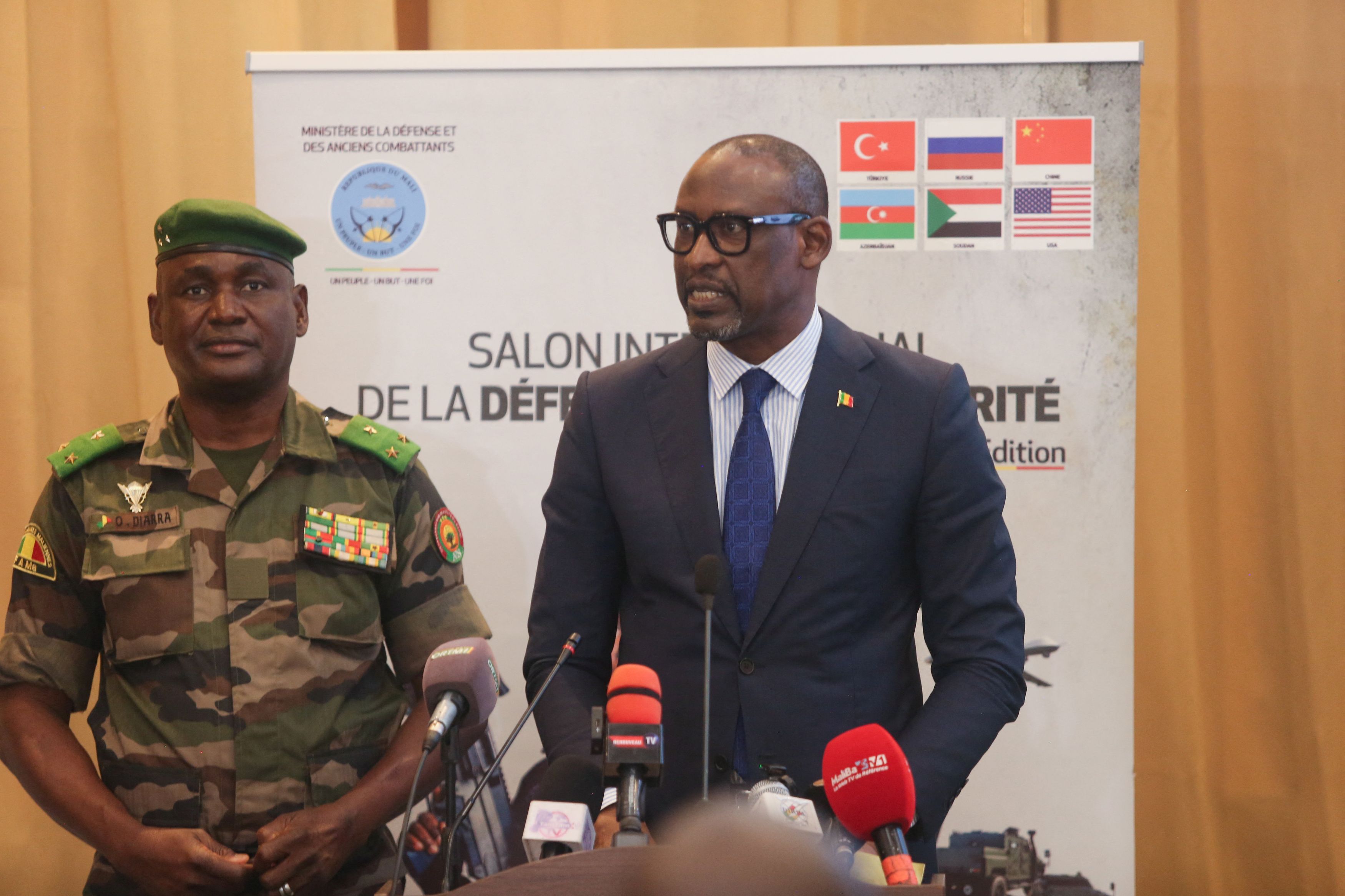 Abdoulaye Diop, Mali’s foreign minister, speaks alongside Gen. Oumar Diarra in the capital of Bamako on Thursday. (Aboubacar Traore/Reuters)