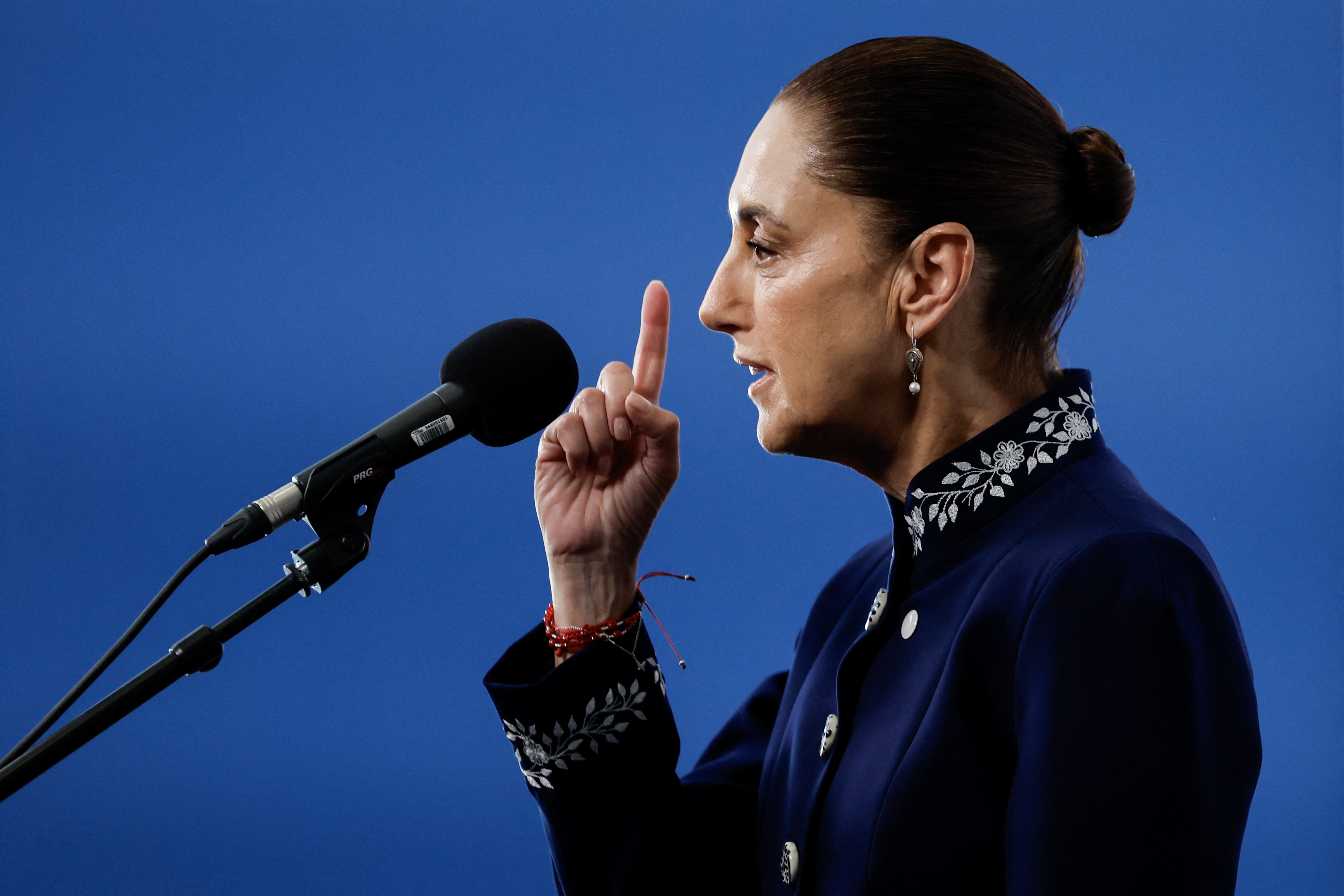 Mexico's President Claudia Sheinbaum speaks to reporters at a gathering of leftist leaders in Barcelona on Saturday. (Oscar Del Pozo/AFP/Getty Images)