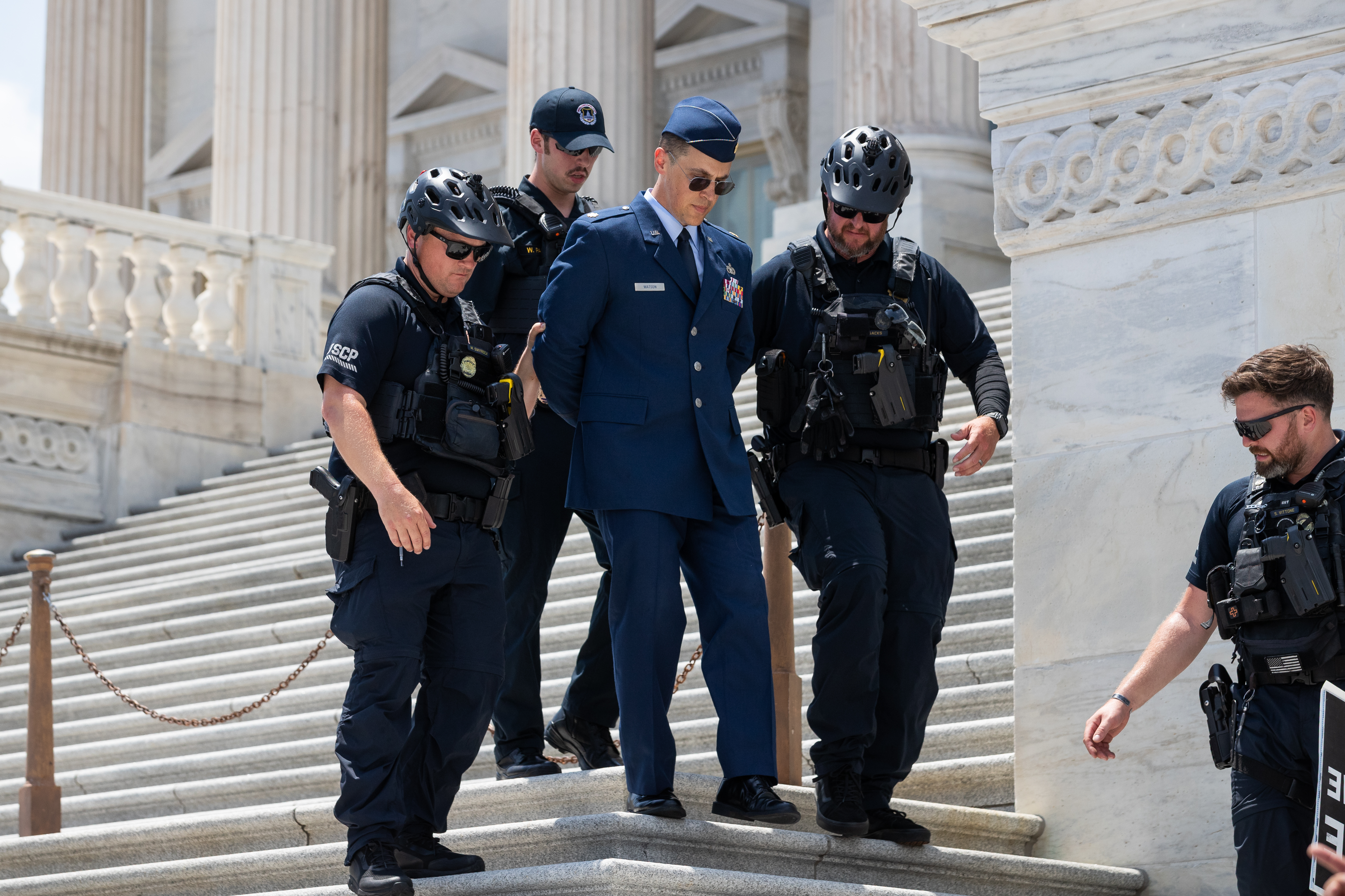 Maj. Jason Watson faces 10 counts covering six incidents, including his protest on the steps outside the U.S. Capitol while in uniform. (Allison Bailey/AP)