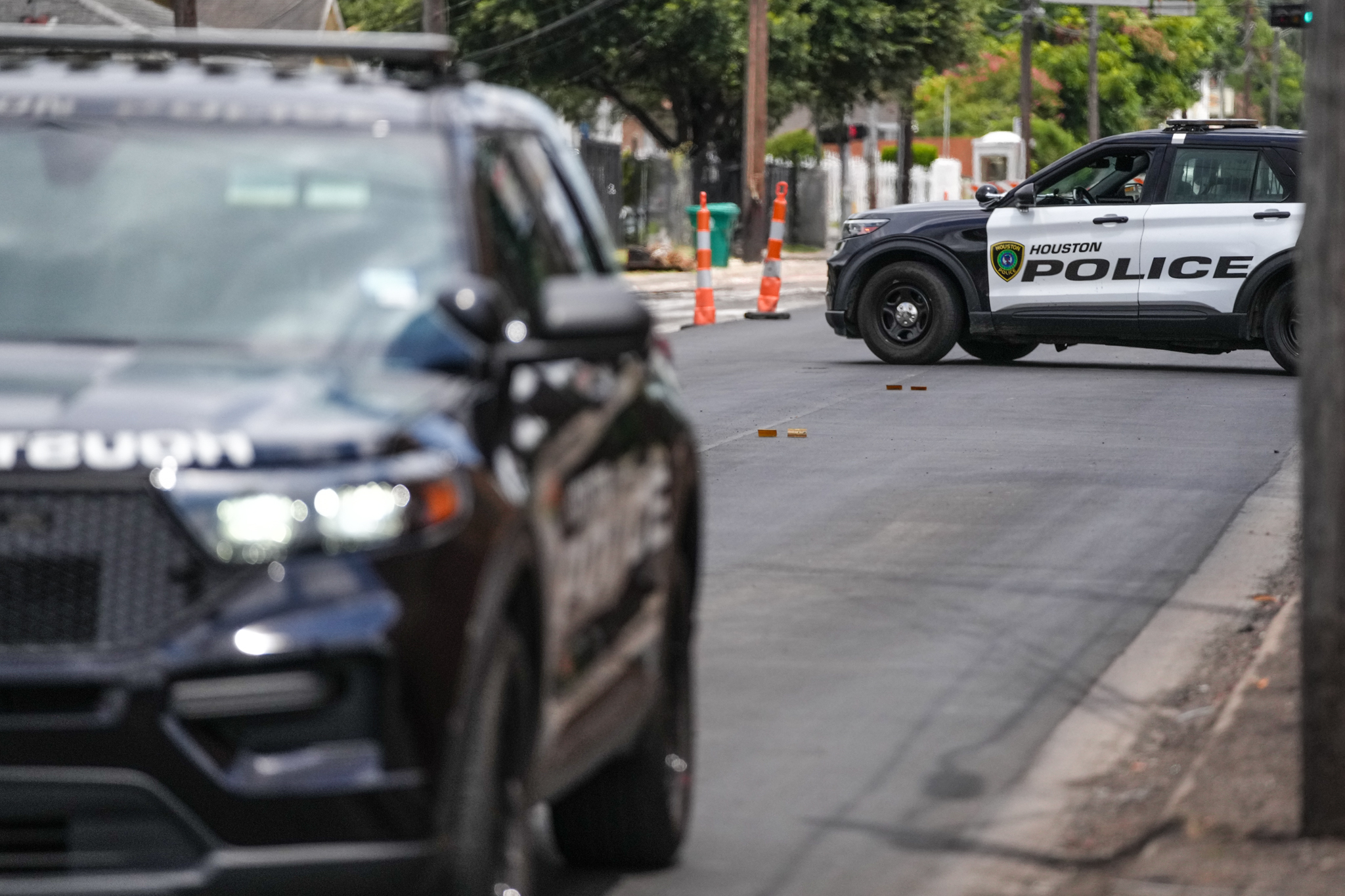 Police are shown on a Houston street on July 7 after the shooting. (Jacob Lujan/Jacob Lujan/Houston Chronicle via AP)