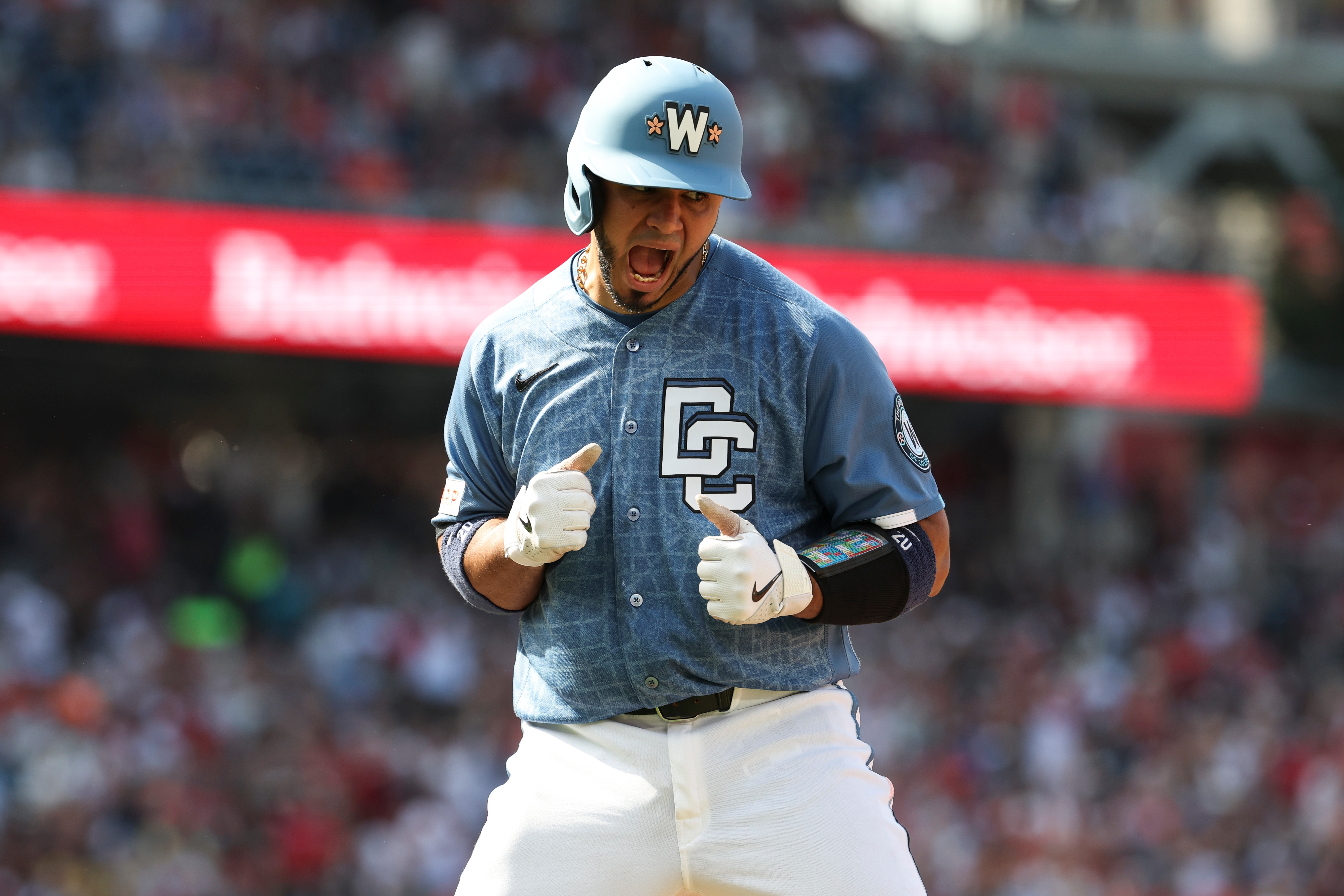 Keibert Ruiz of the Washington Nationals celebrates as he runs the bases after hitting a three-run home run off Baltimore Orioles pitcher Chris Bassitt on Saturday. (Terrance Williams/AP)