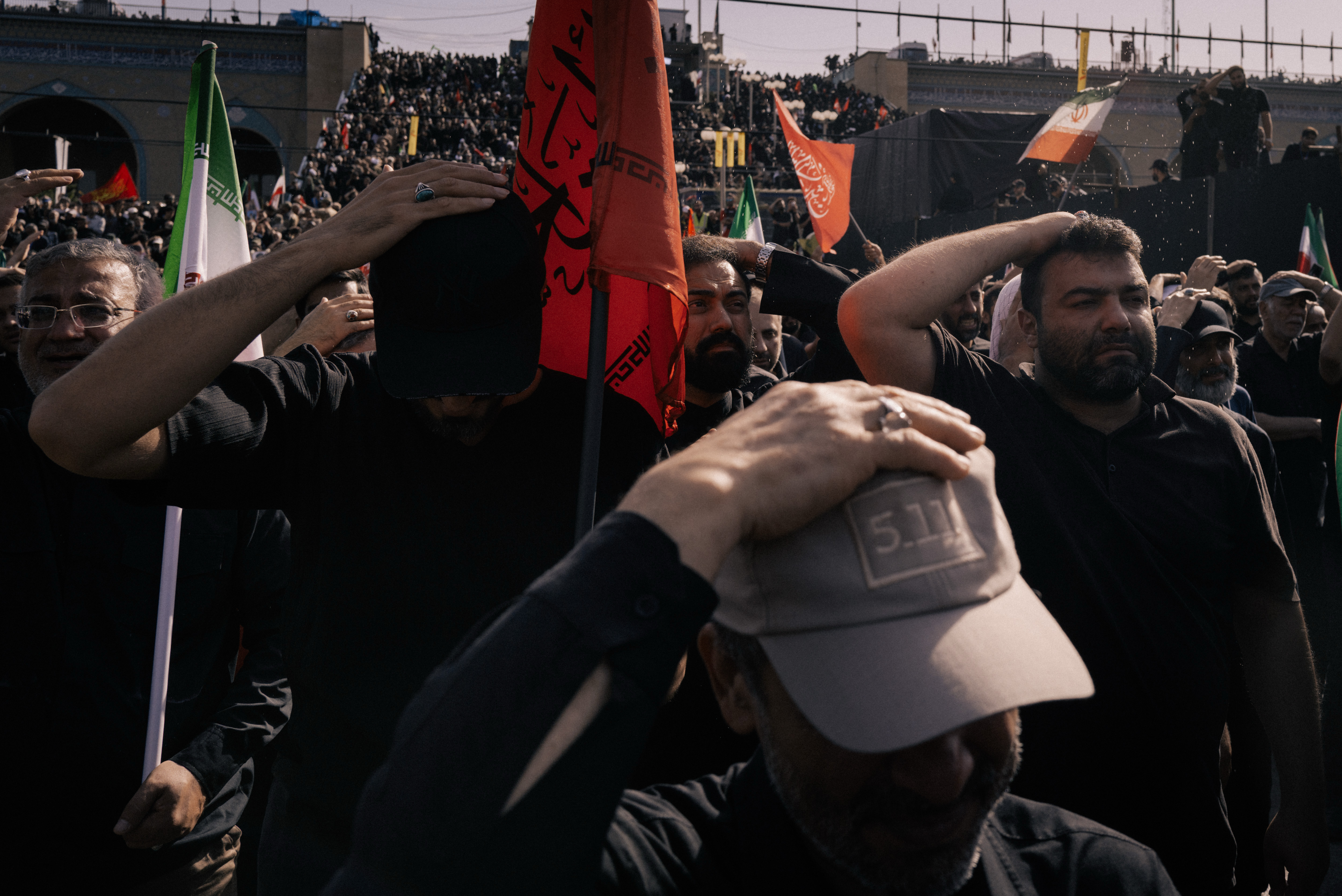 Many mourners carried red flags calling for bloodshed.
