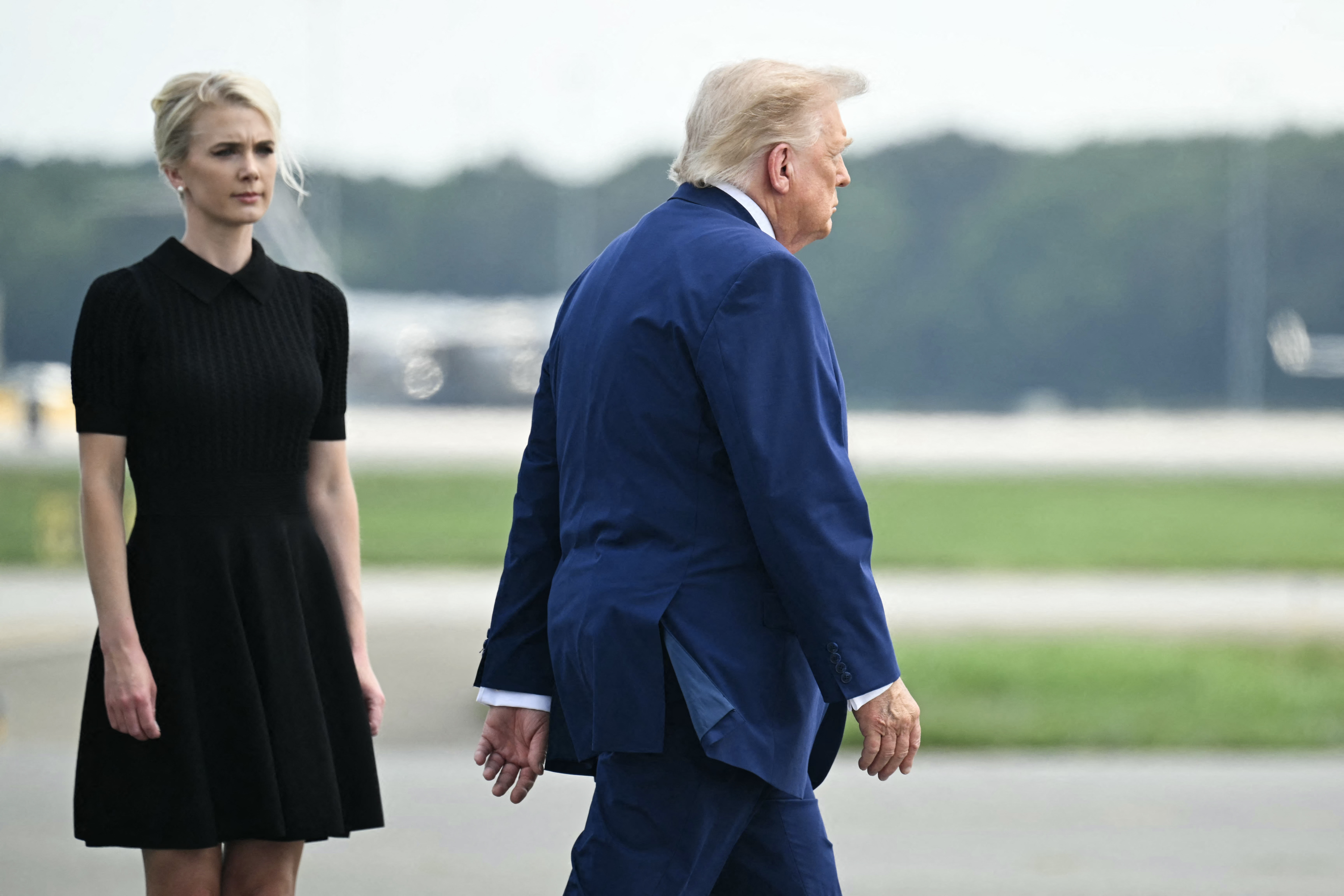 President Donald Trump, with aide Natalie Harp, at Dover Air Force Base in Delaware on July 22. (Saul Loeb/AFP/Getty Images)