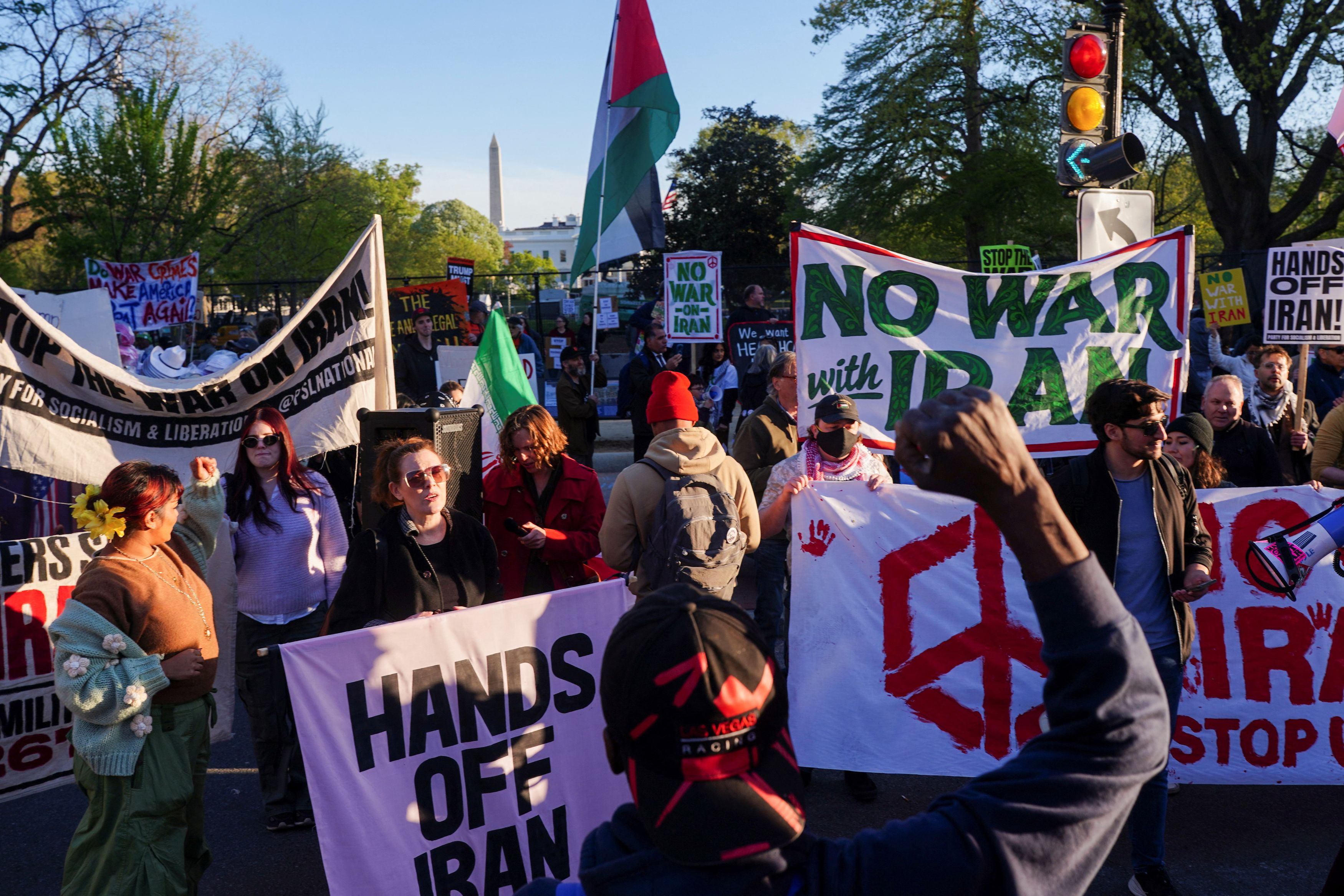 Demonstrators protest military action in Iran outside the White House on Tuesday. (Nathan Howard/Reuters)